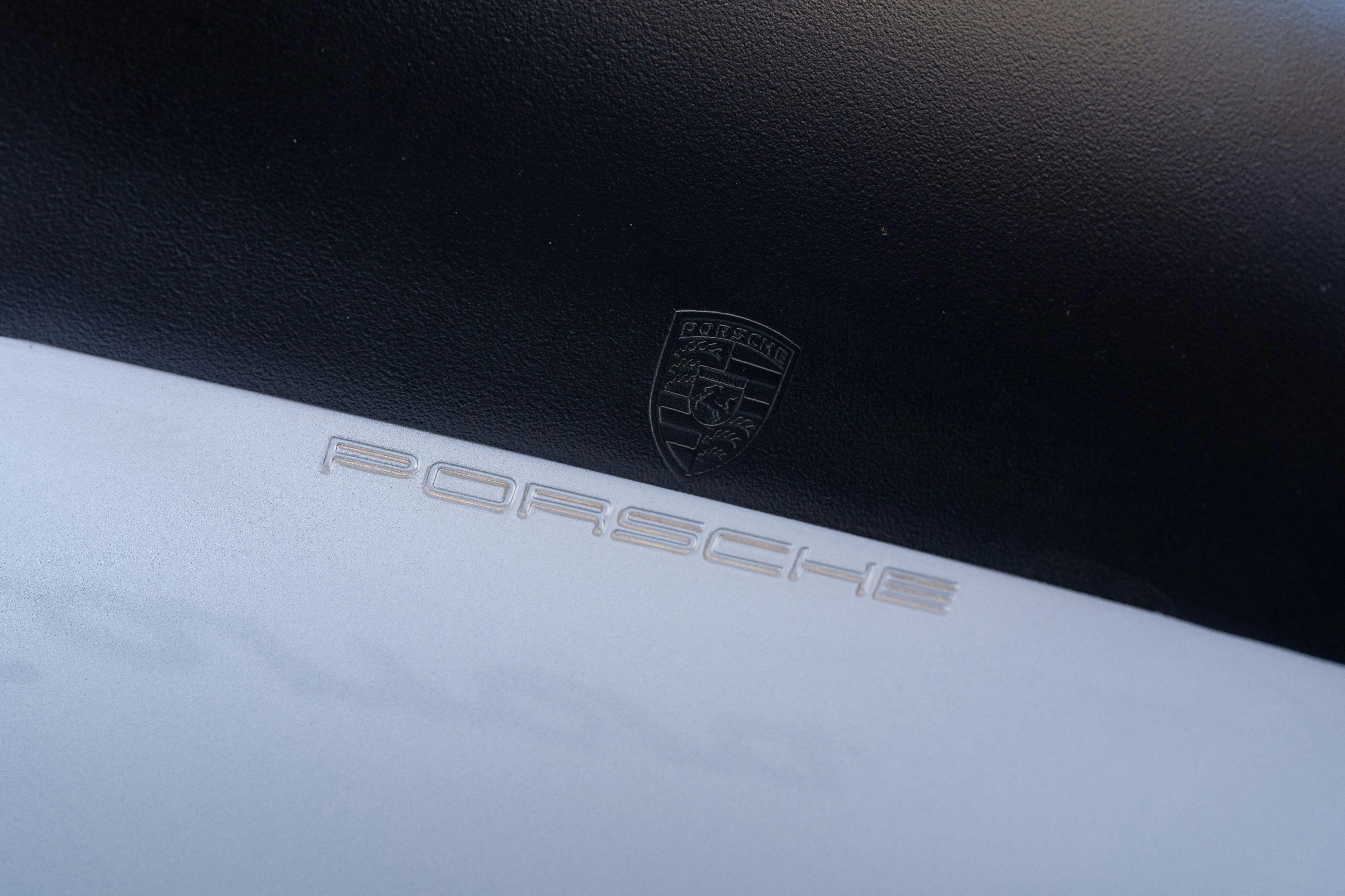 Stamping under the wing of a 1987 Porsche 911 Carrera G50 Coupe in Silver Metallic in Dripping Springs, TX.