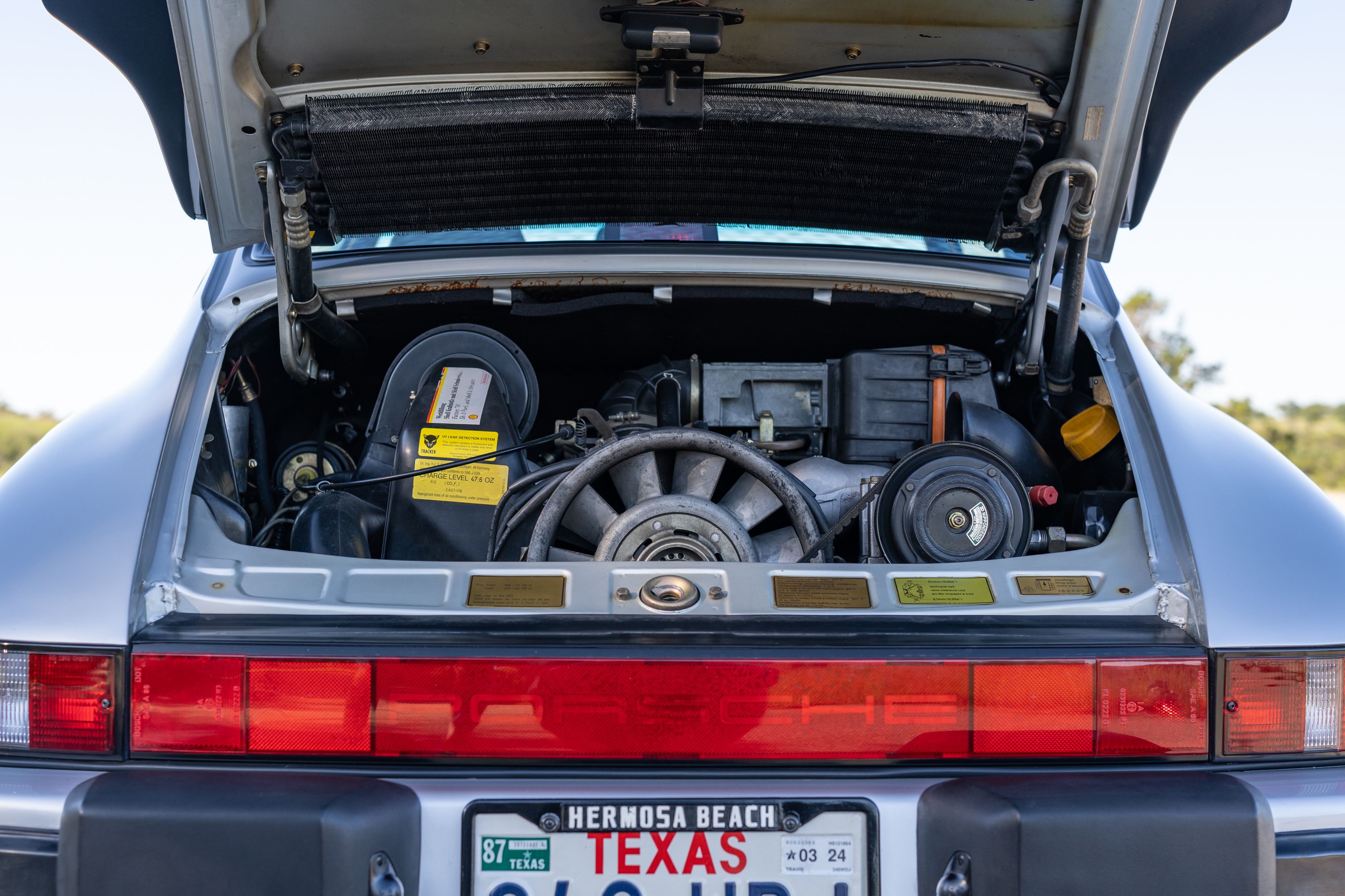 Engine bay of a Silver Grey leather in a 1987 Porsche 911 Carrera G50 Coupe in Silver Metallic in Dripping Springs, TX.