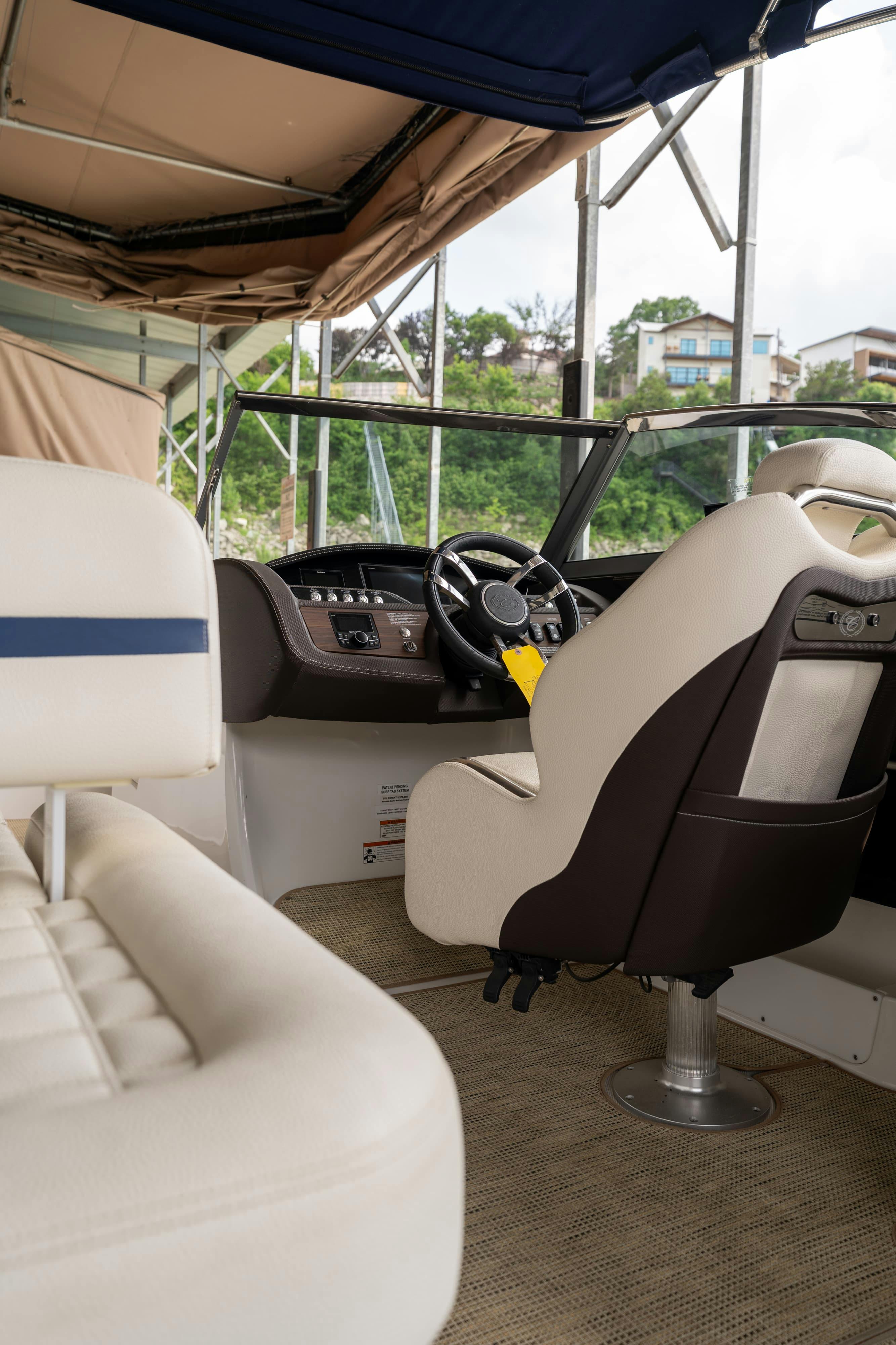 Captain's controls in a 2018 Cobalt R7 Surf boat in Lakeway, TX.