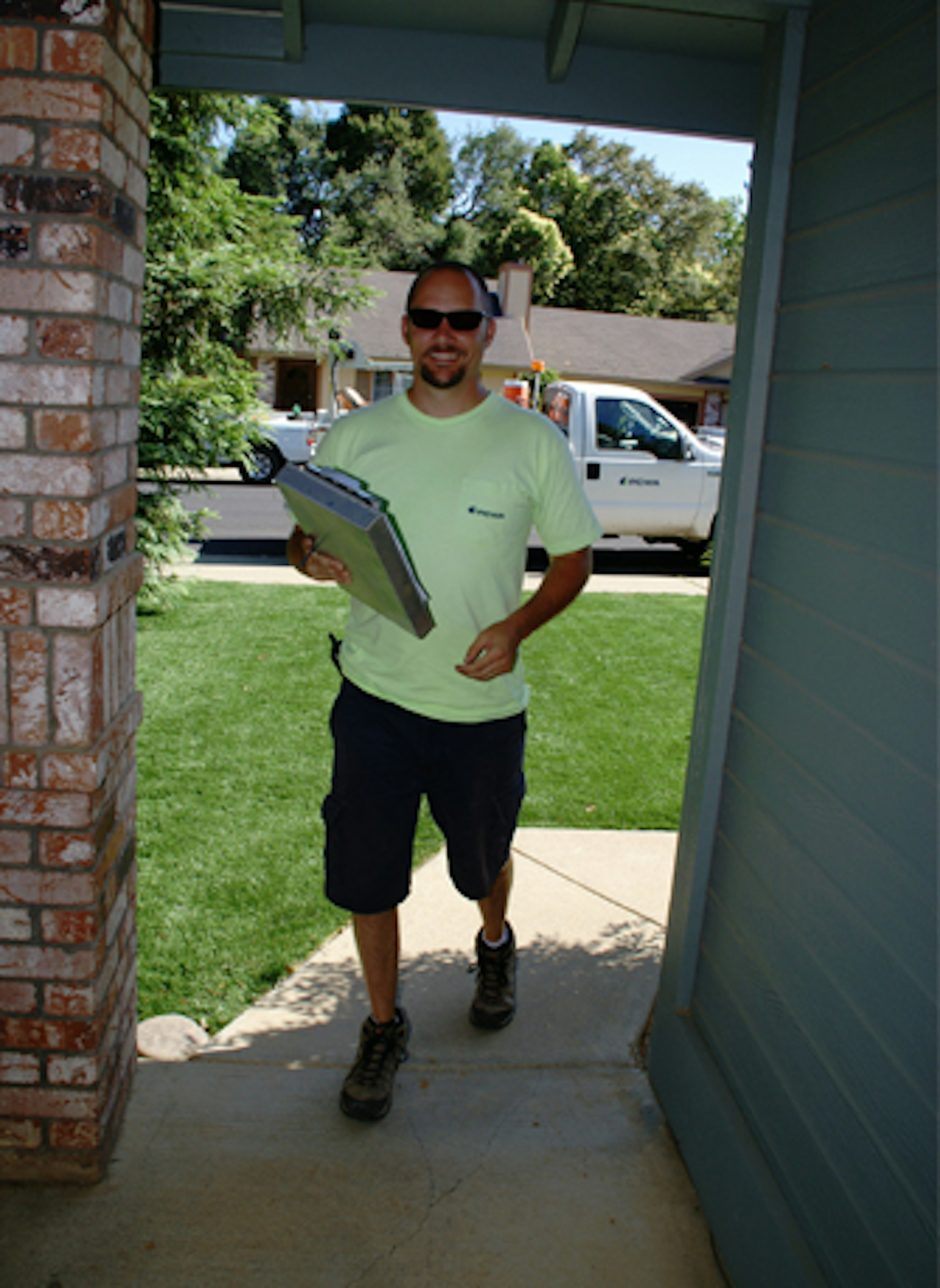 A photo of a PCWA Employee Approaching a Customer's House