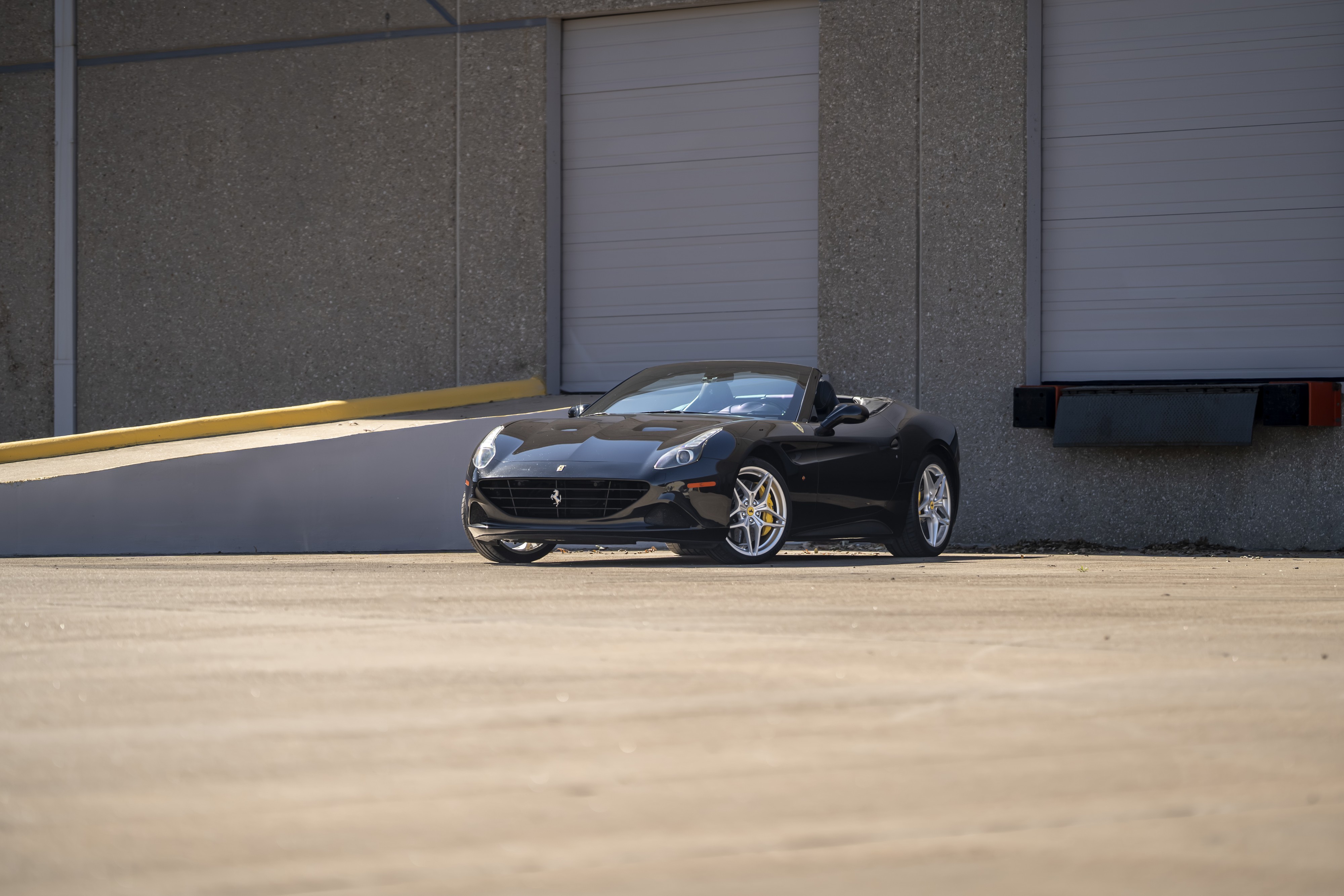 2016 Ferrari California T in black at Petrol Lounge in Austin, TX.