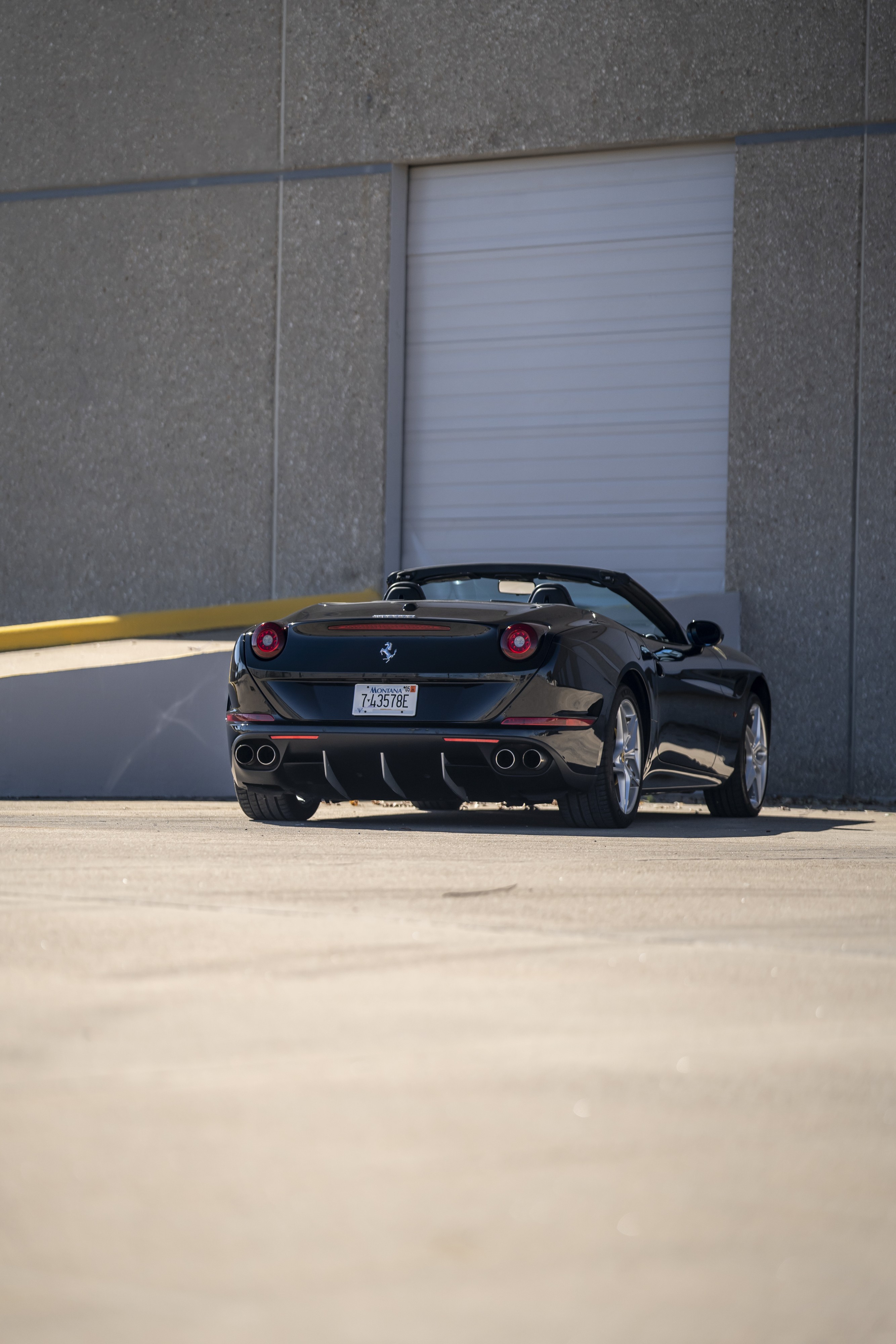 2016 Ferrari California T in black at Petrol Lounge in Austin, TX.