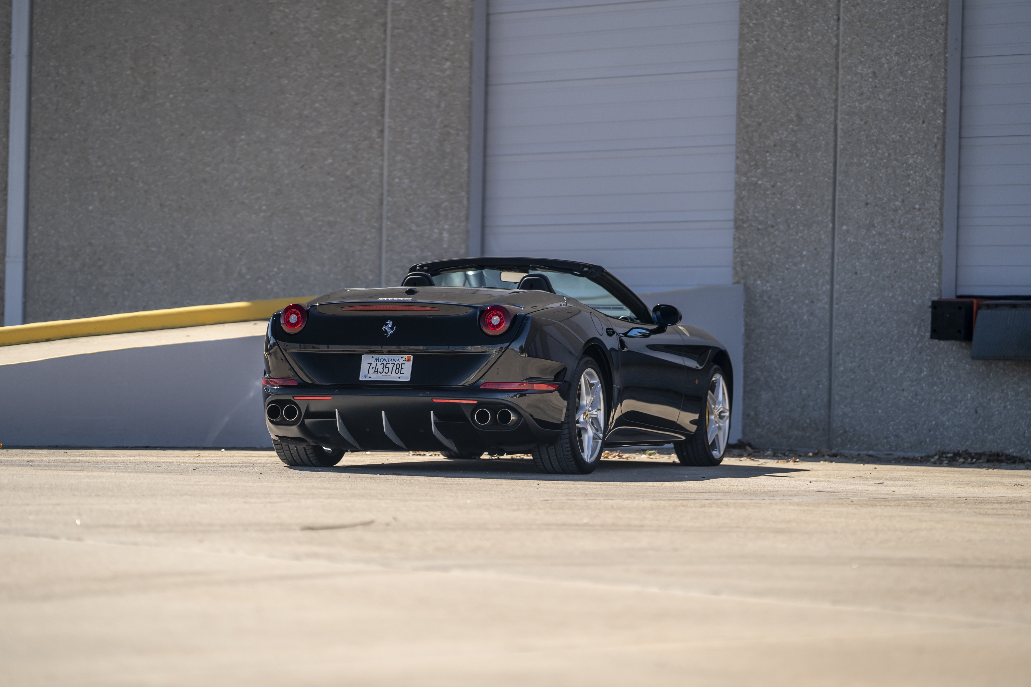 2016 Ferrari California T in black at Petrol Lounge in Austin, TX.