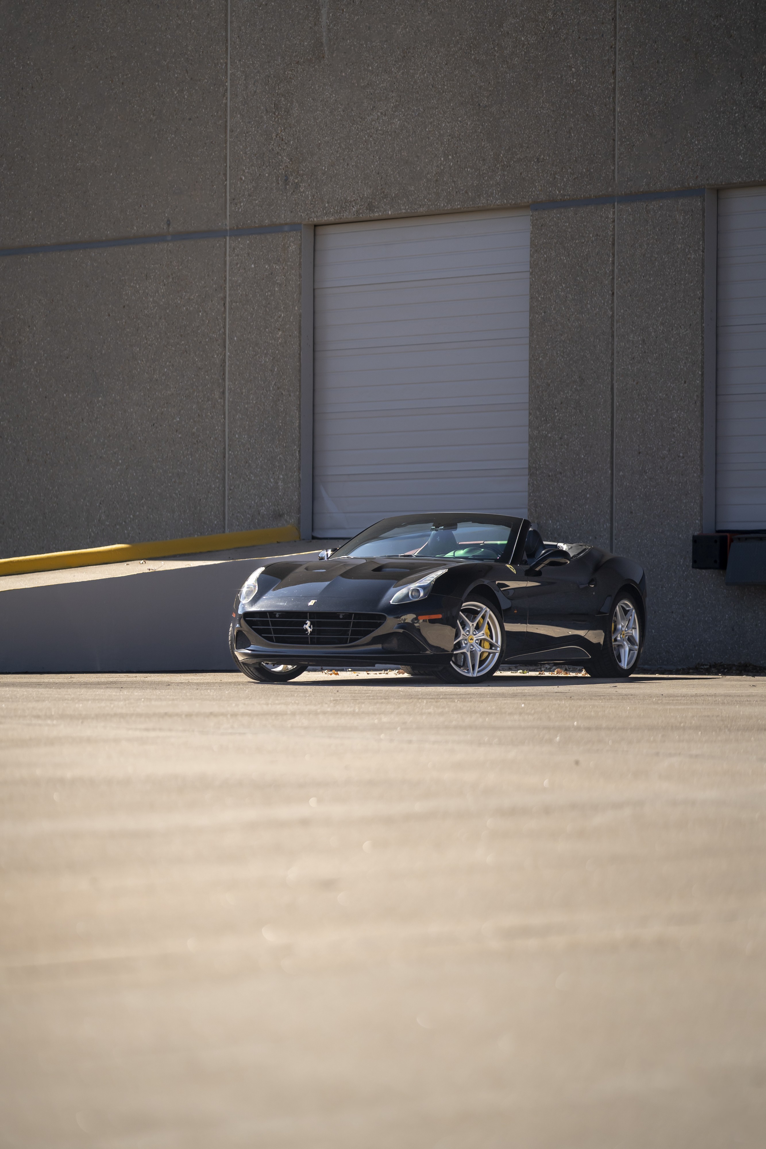 2016 Ferrari California T in black at Petrol Lounge in Austin, TX.