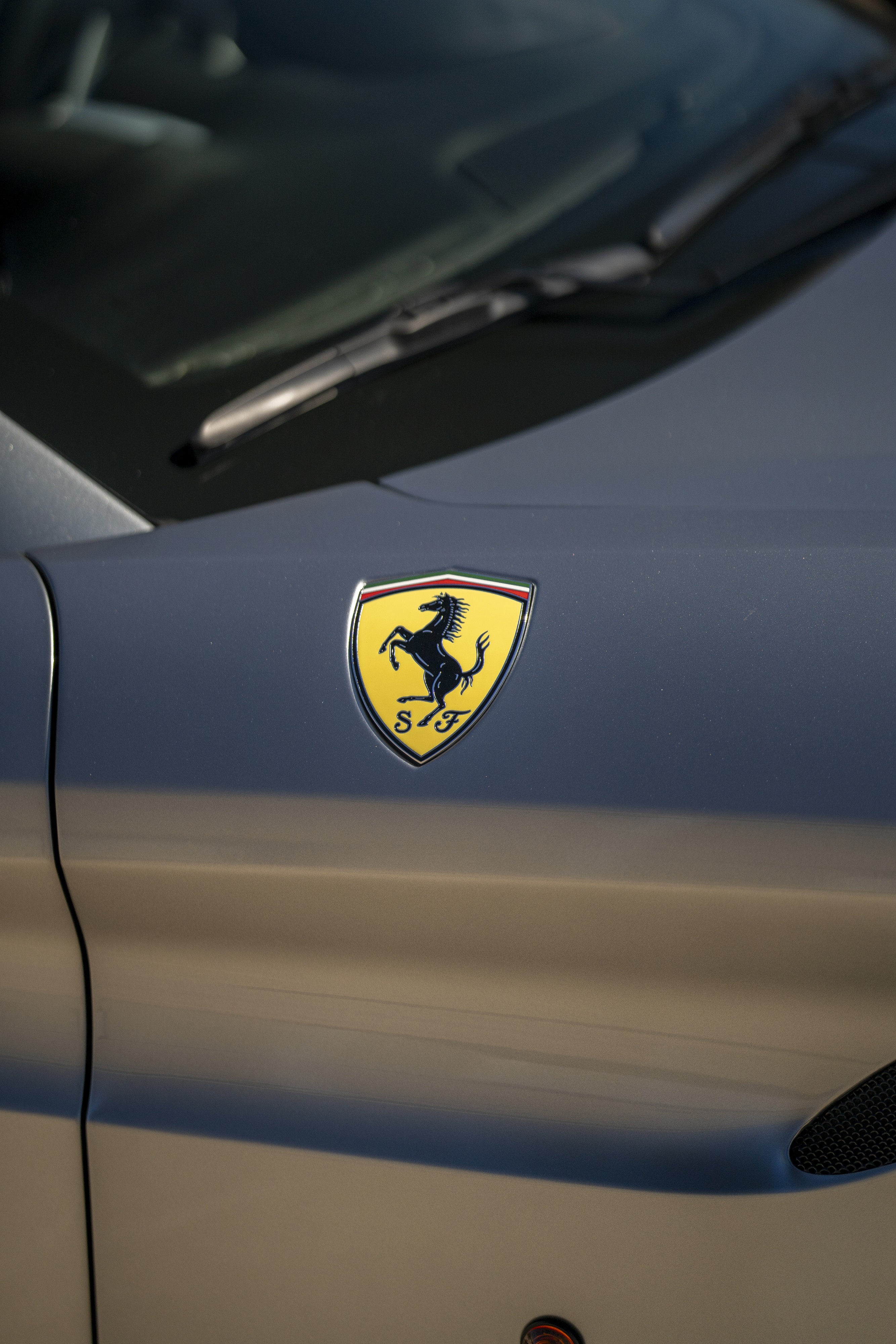 Prancing Horse Ferrari Logo on a silver 2016 Ferrari California T.