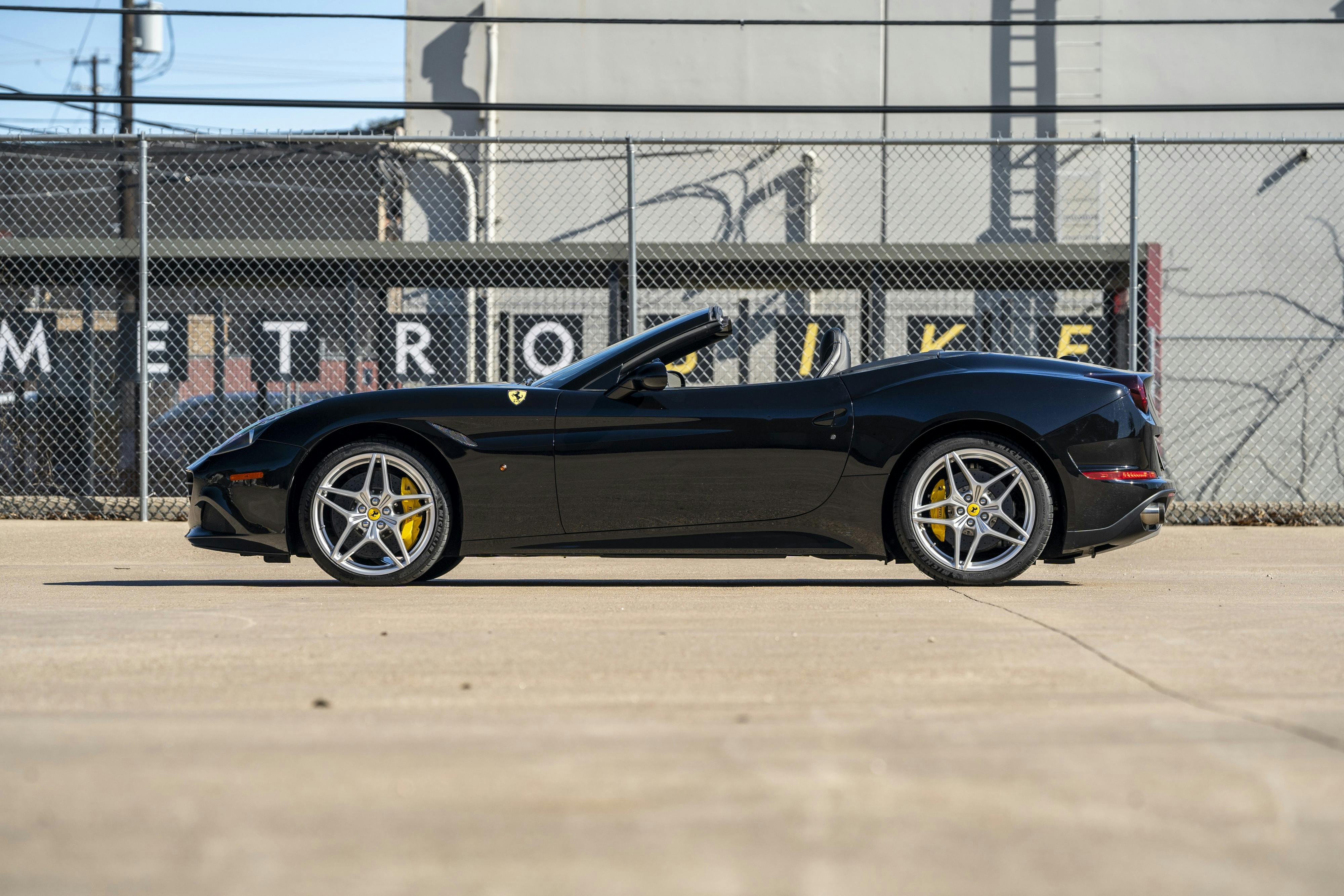 2016 Ferrari California T in black at Petrol Lounge in Austin, TX.