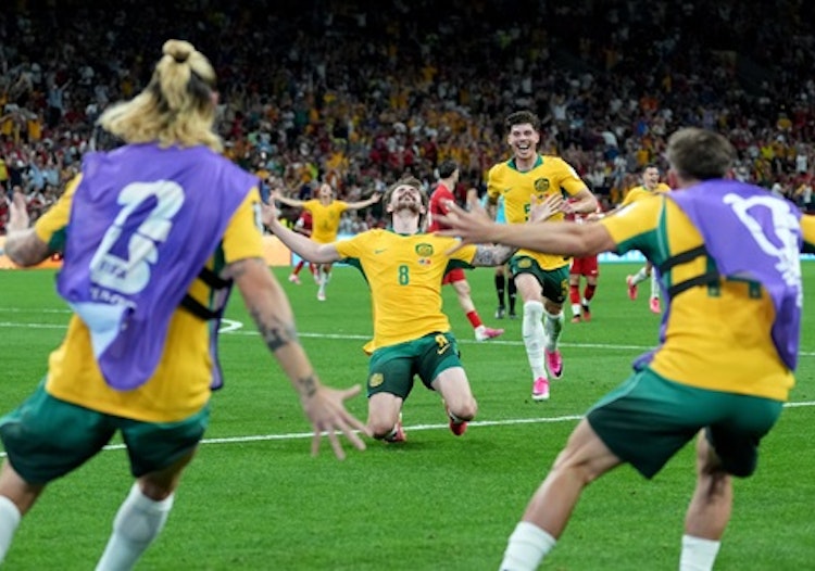 Australia's Connor Metcalfe celebrates with his teammates after scoring their second goal during the World Cup Group D match against Turkey.
