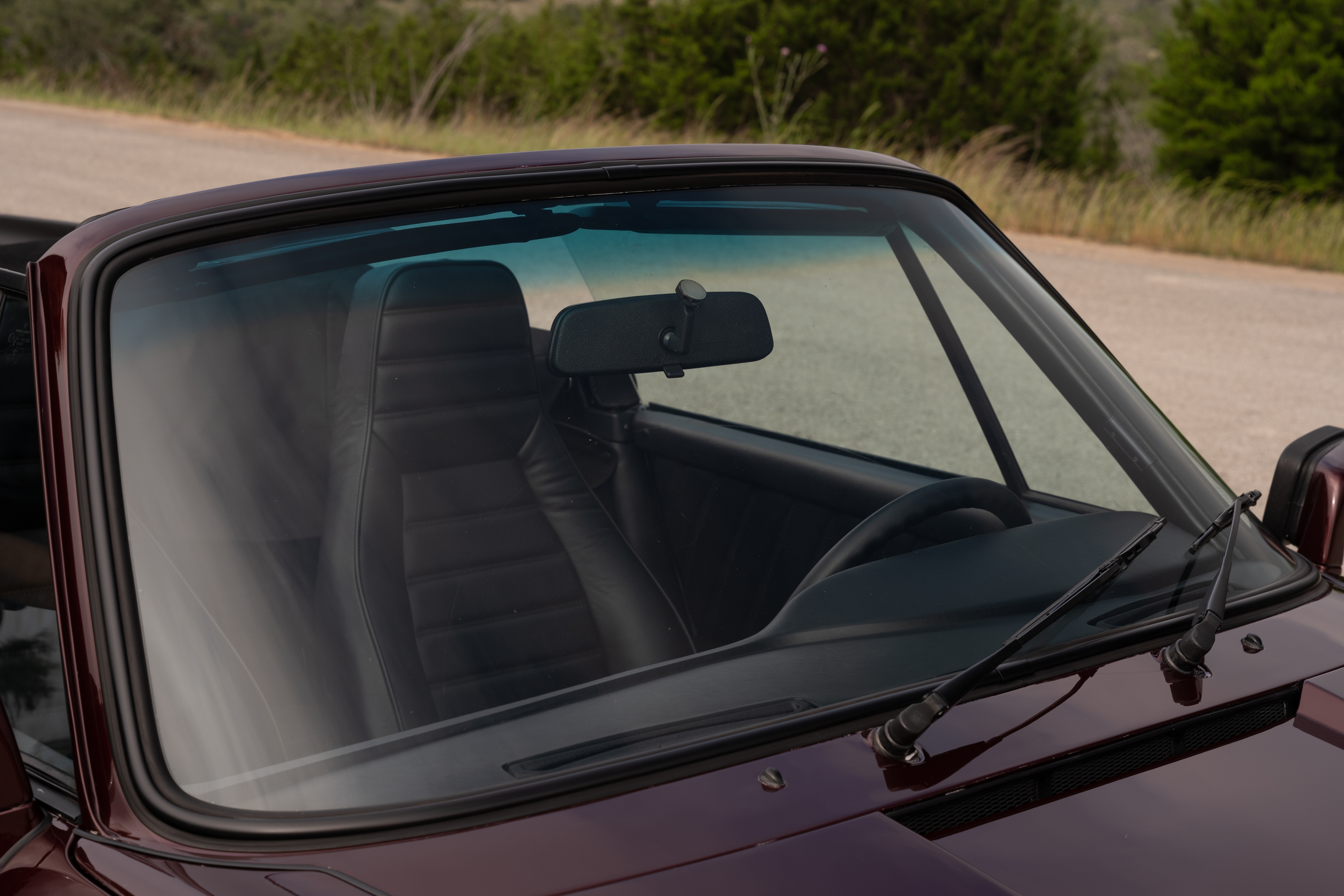 1983 Porsche 911SC Cabriolet in Metallic Red shot in Austin, TX.