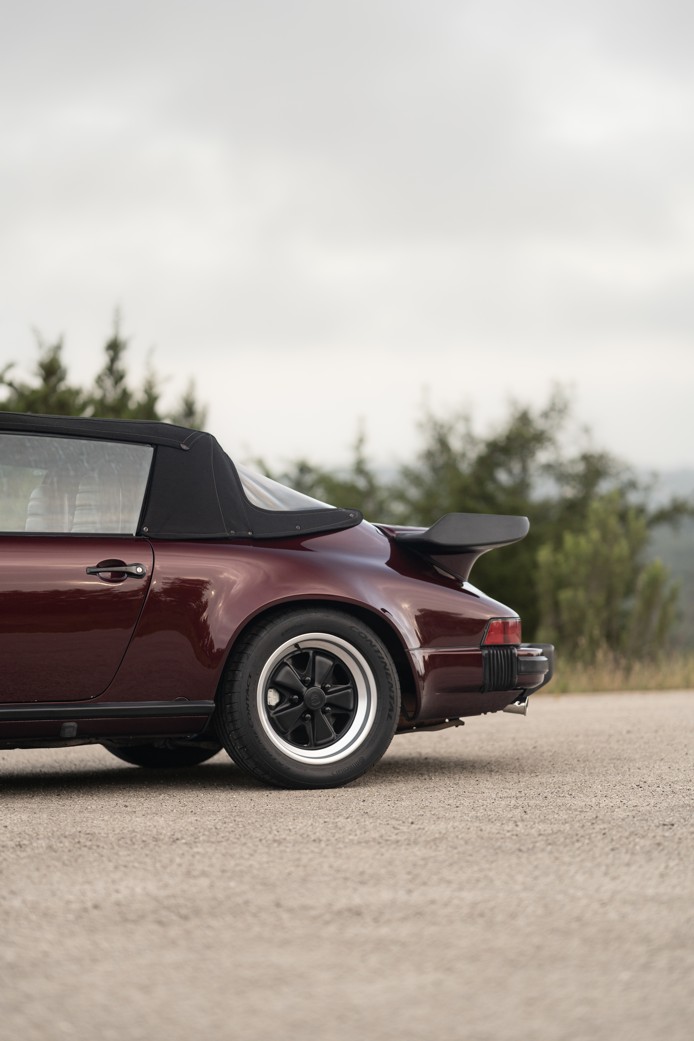 1983 Porsche 911SC Cabriolet in Metallic Red shot in Austin, TX.