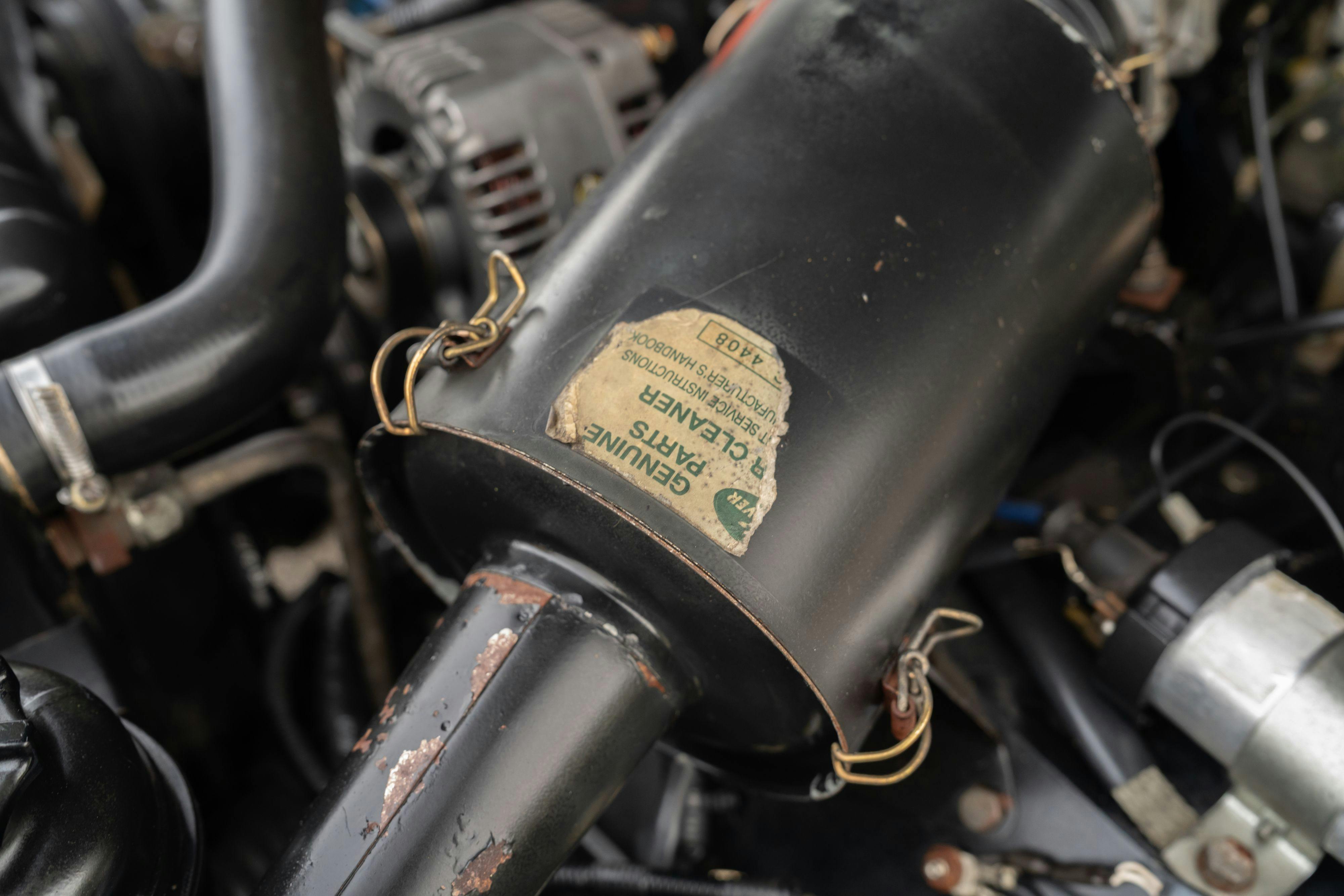 Engine bay of a 1994 Range Rover LWB in Beluga Black over Dark Sable in Austin, TX.