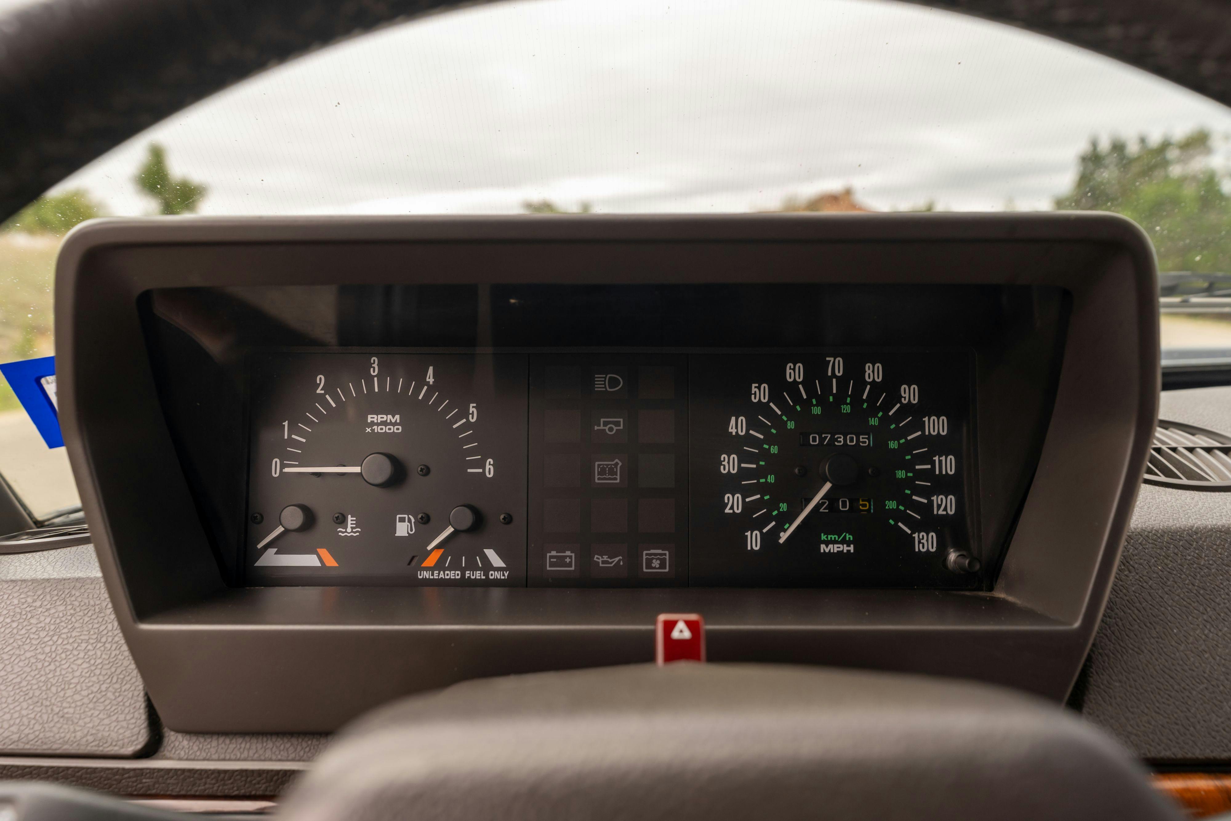 Gauge cluster of a 1994 Range Rover LWB in Beluga Black over Dark Sable in Austin, TX.