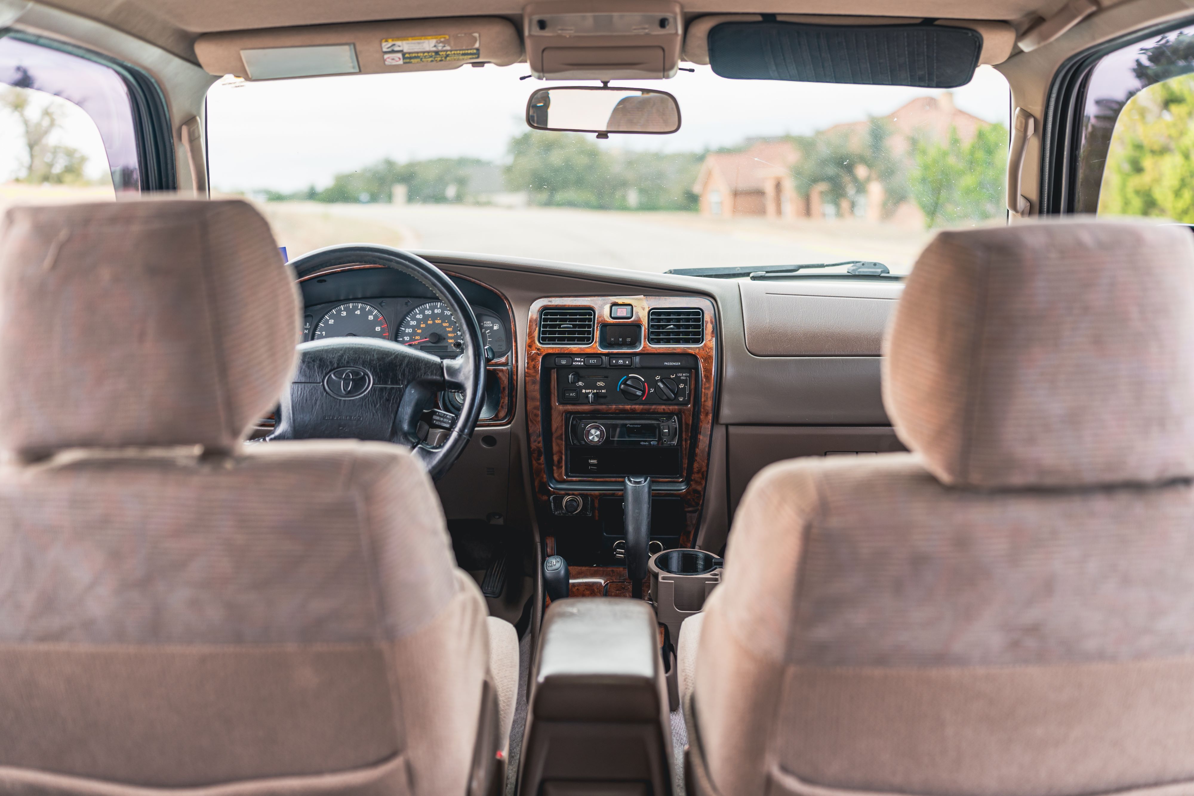 Tan interior of an Imperial Jade Mica 2000 Toyota 4Runner SR5 shot in Austin, TX.