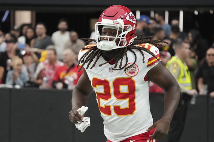 Kansas City Chiefs running back warming up