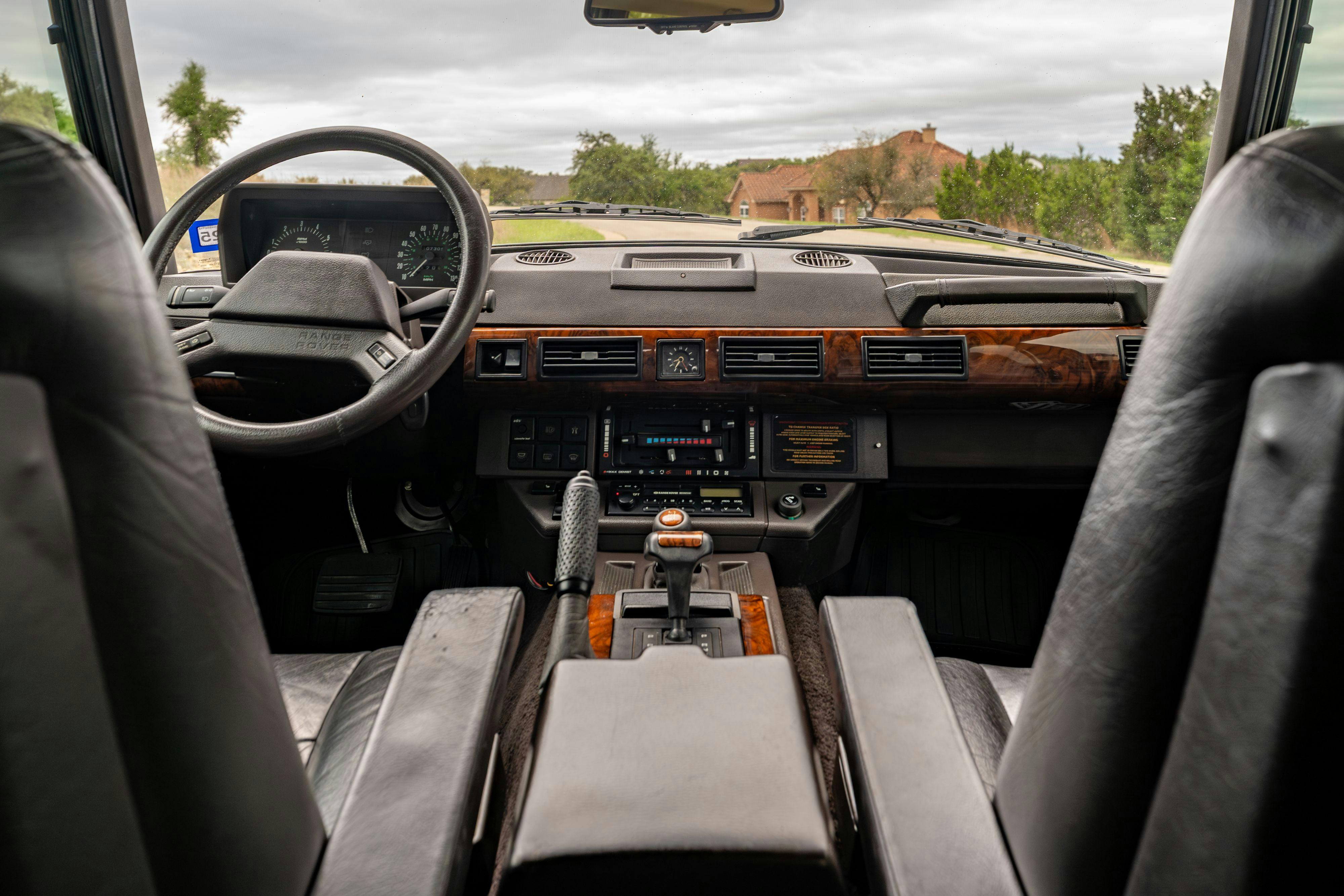 Interior of a 1994 Range Rover LWB in Beluga Black over Dark Sable in Austin, TX.