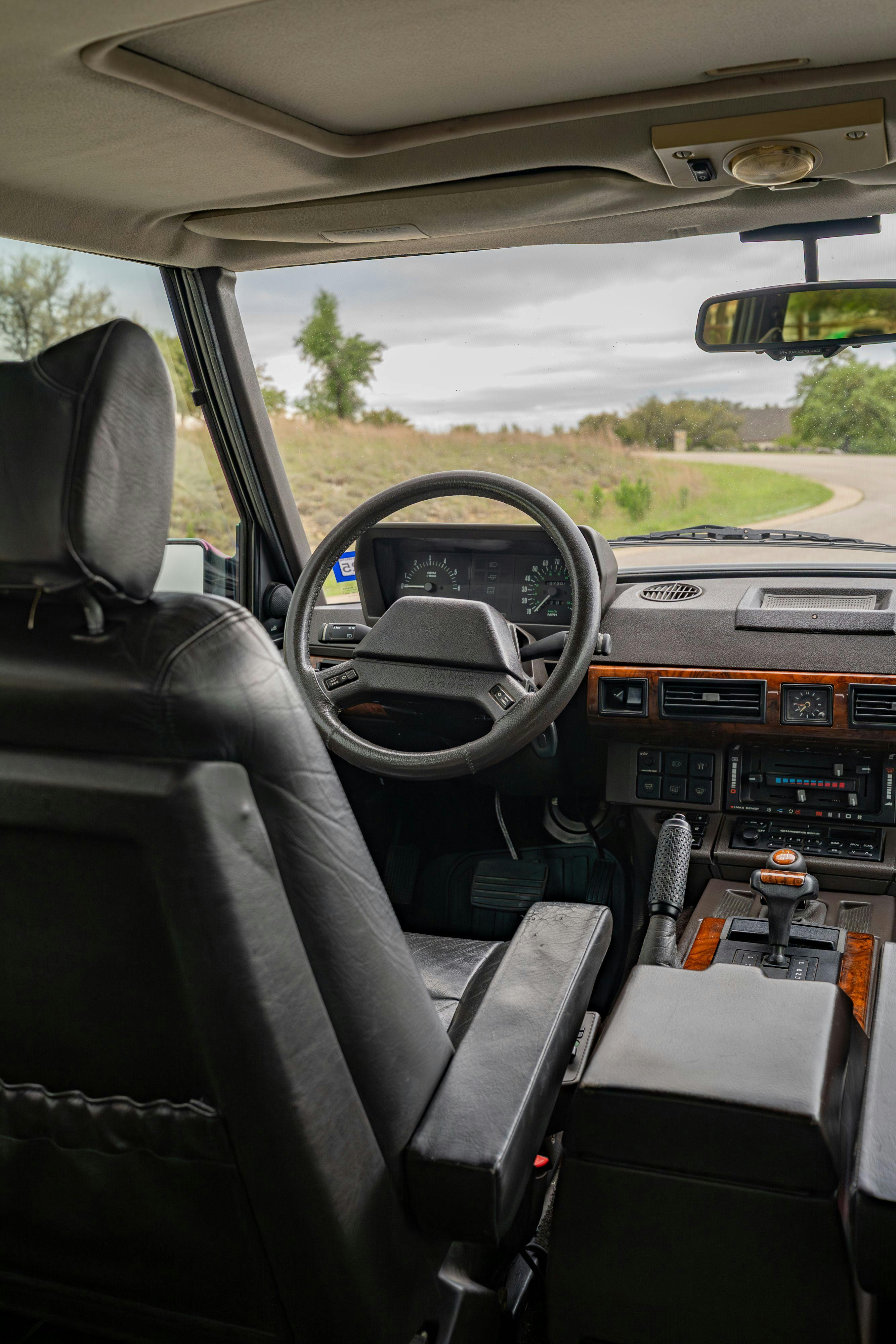 Interior of a 1994 Range Rover LWB in Beluga Black over Dark Sable in Austin, TX.