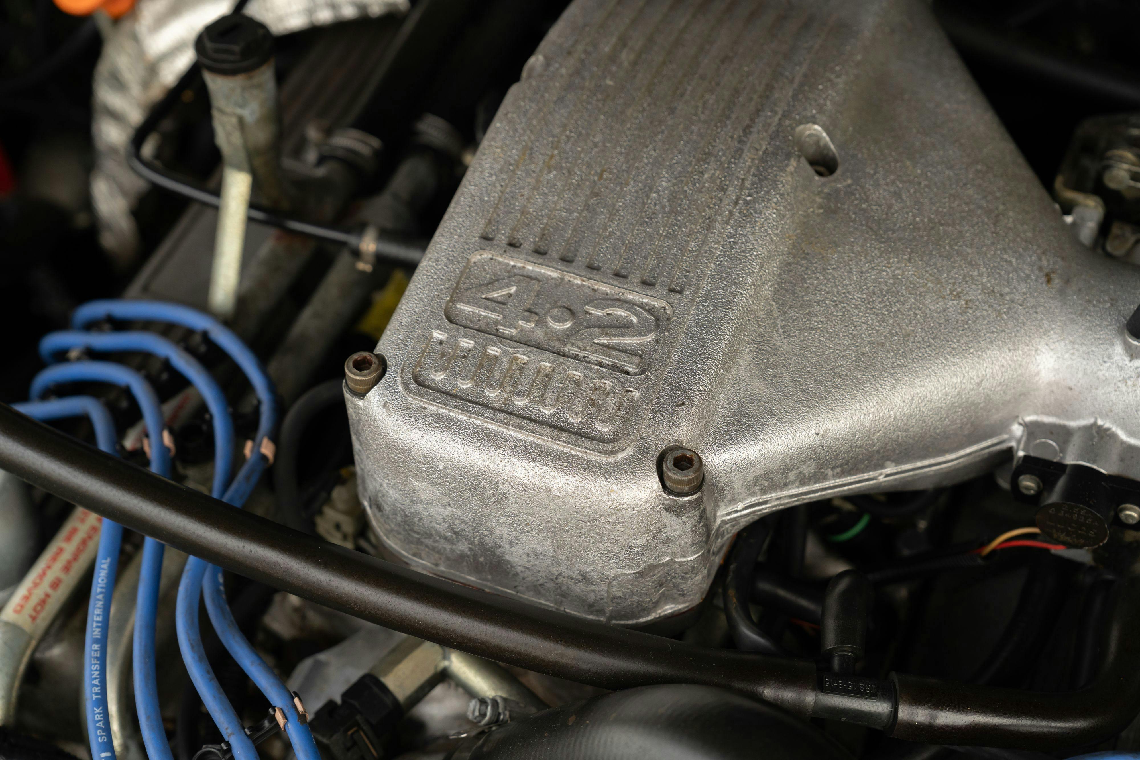 Engine bay of a 1994 Range Rover LWB in Beluga Black over Dark Sable in Austin, TX.