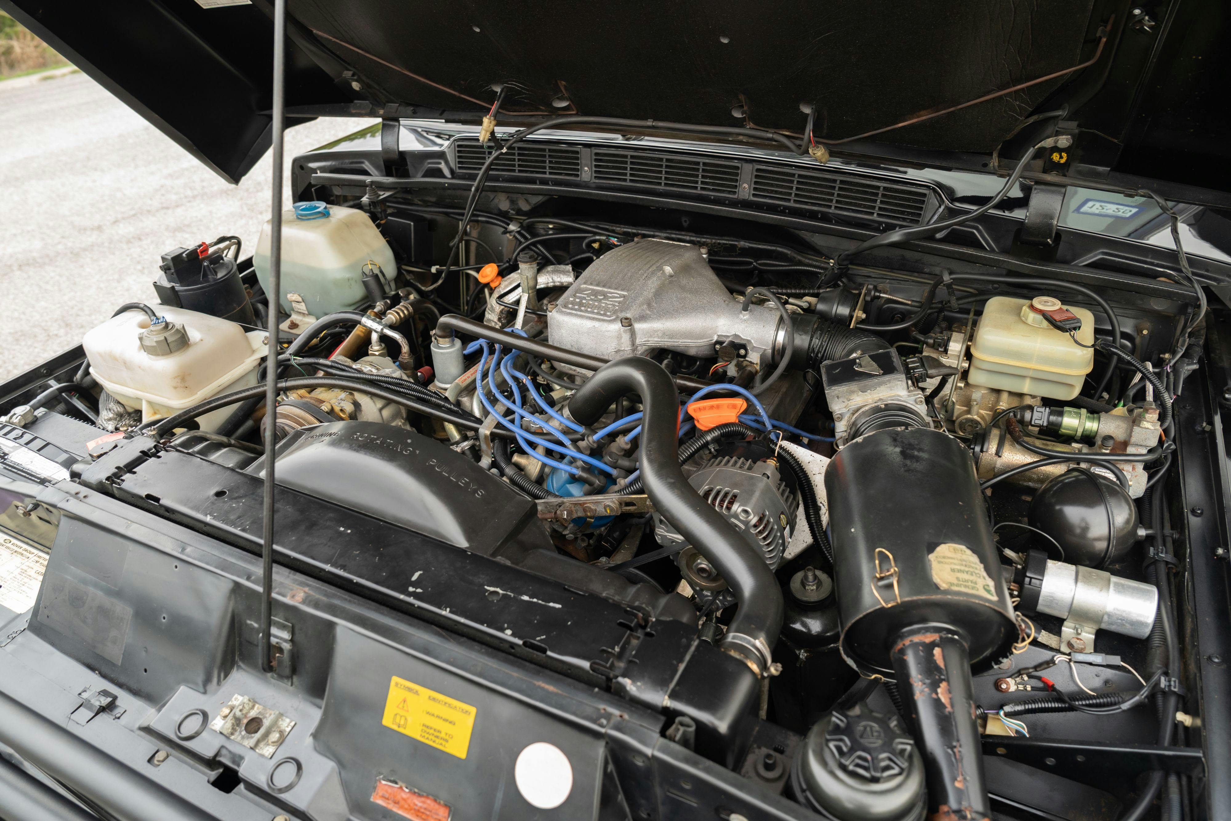 Engine bay of a 1994 Range Rover LWB in Beluga Black over Dark Sable in Austin, TX.