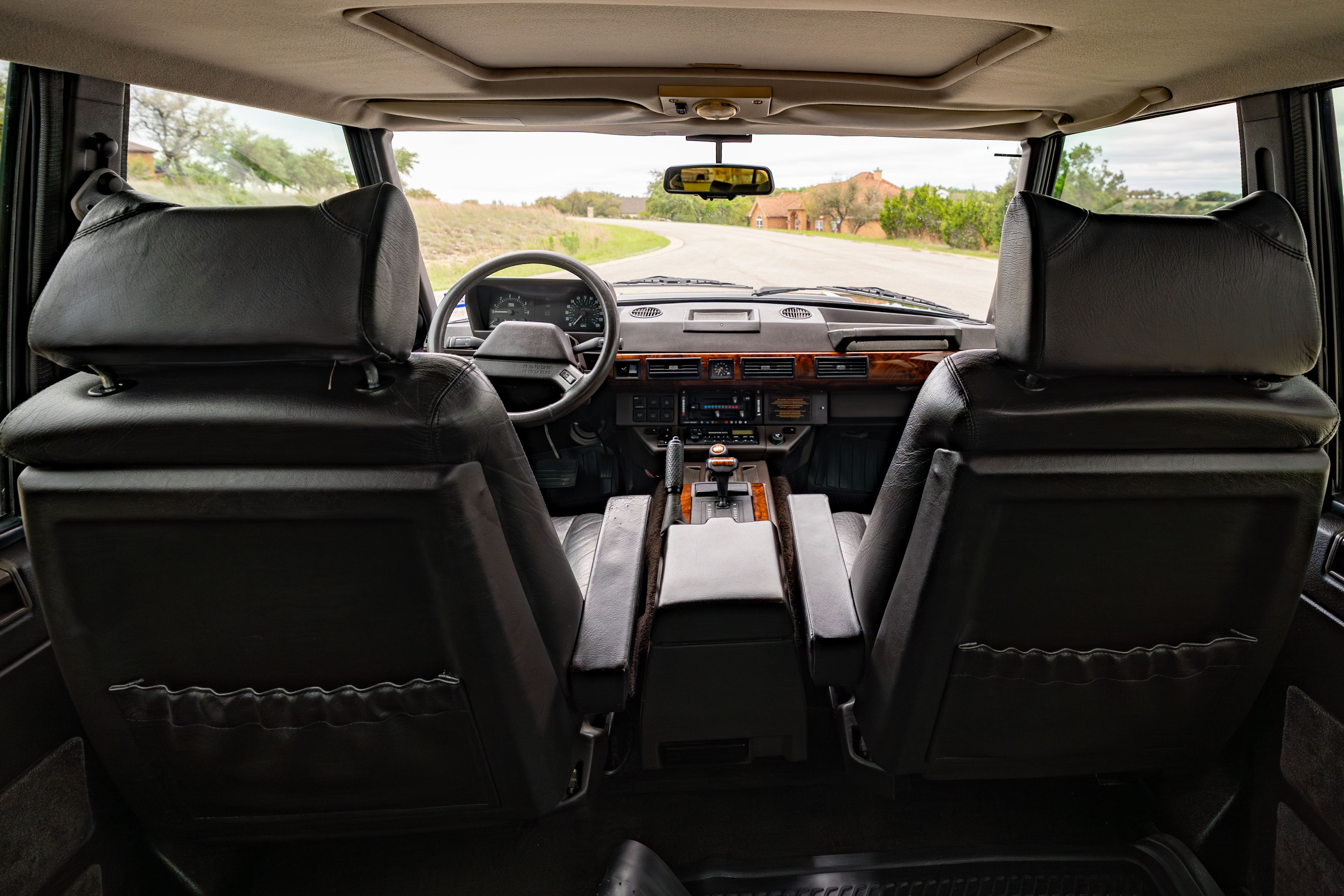 Interior of a 1994 Range Rover LWB in Beluga Black over Dark Sable in Austin, TX.