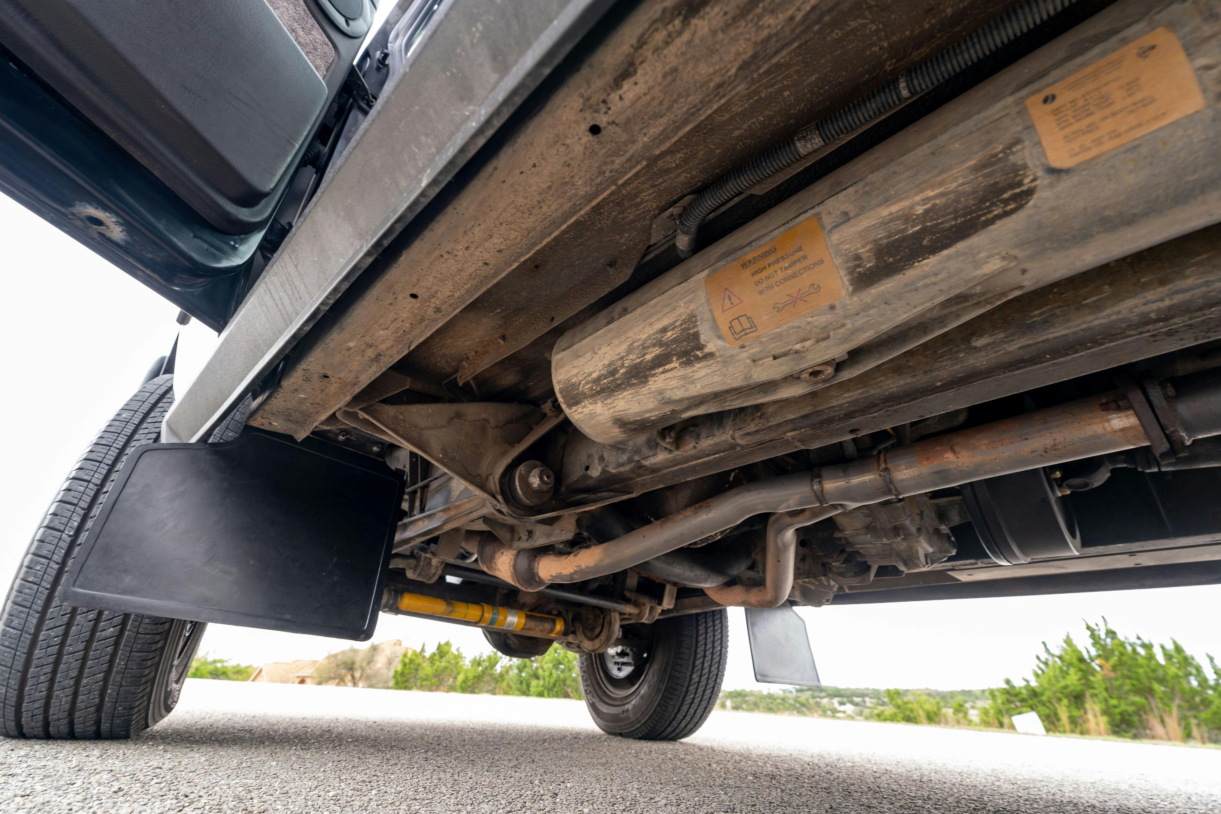 Underbody of a 1994 Range Rover LWB in Beluga Black over Dark Sable in Austin, TX.