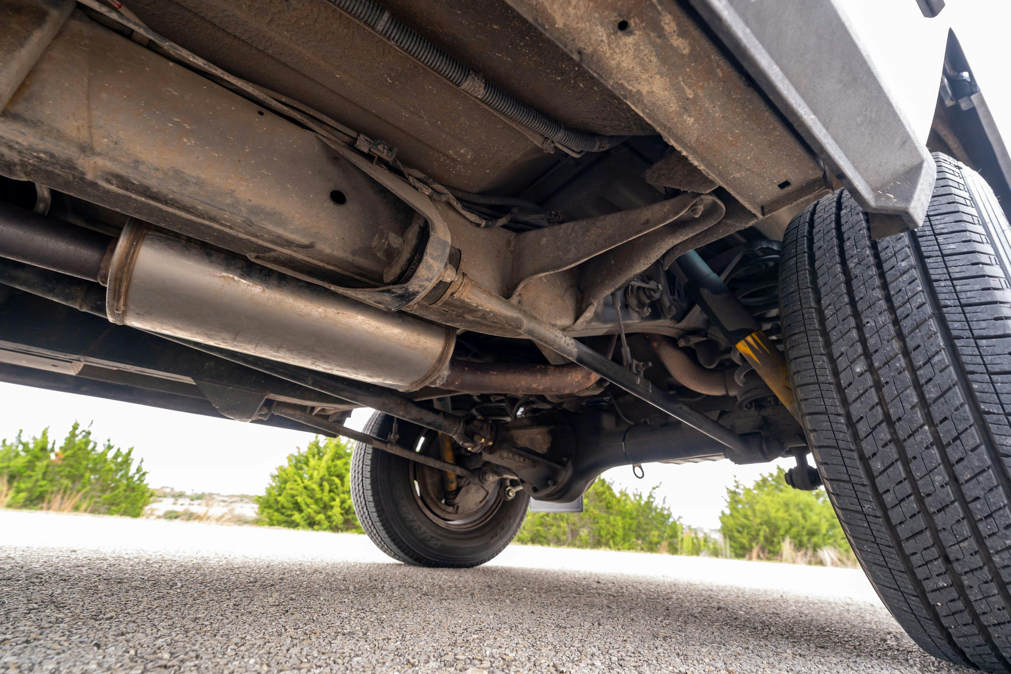 Underbody of a 1994 Range Rover LWB in Beluga Black over Dark Sable in Austin, TX.