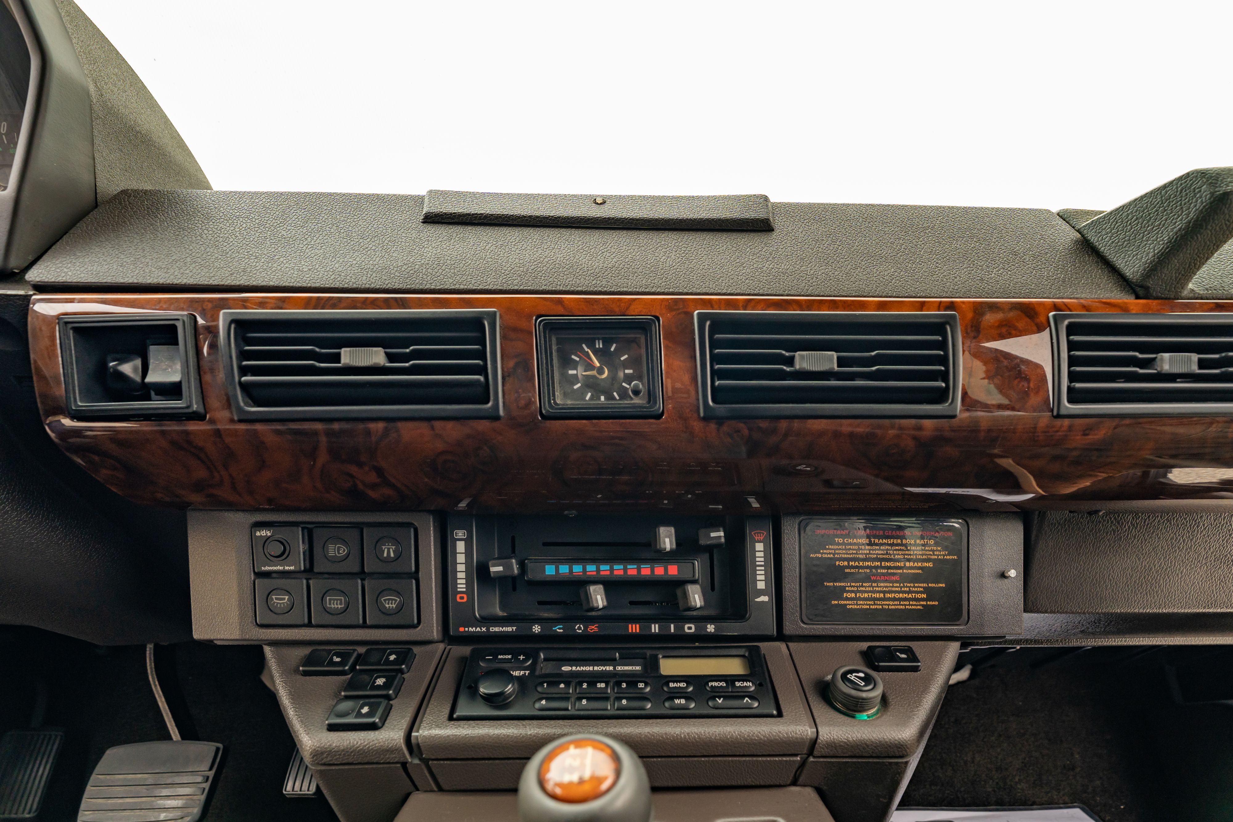 Dashboard of a 1994 Range Rover LWB in Beluga Black over Dark Sable in Austin, TX.