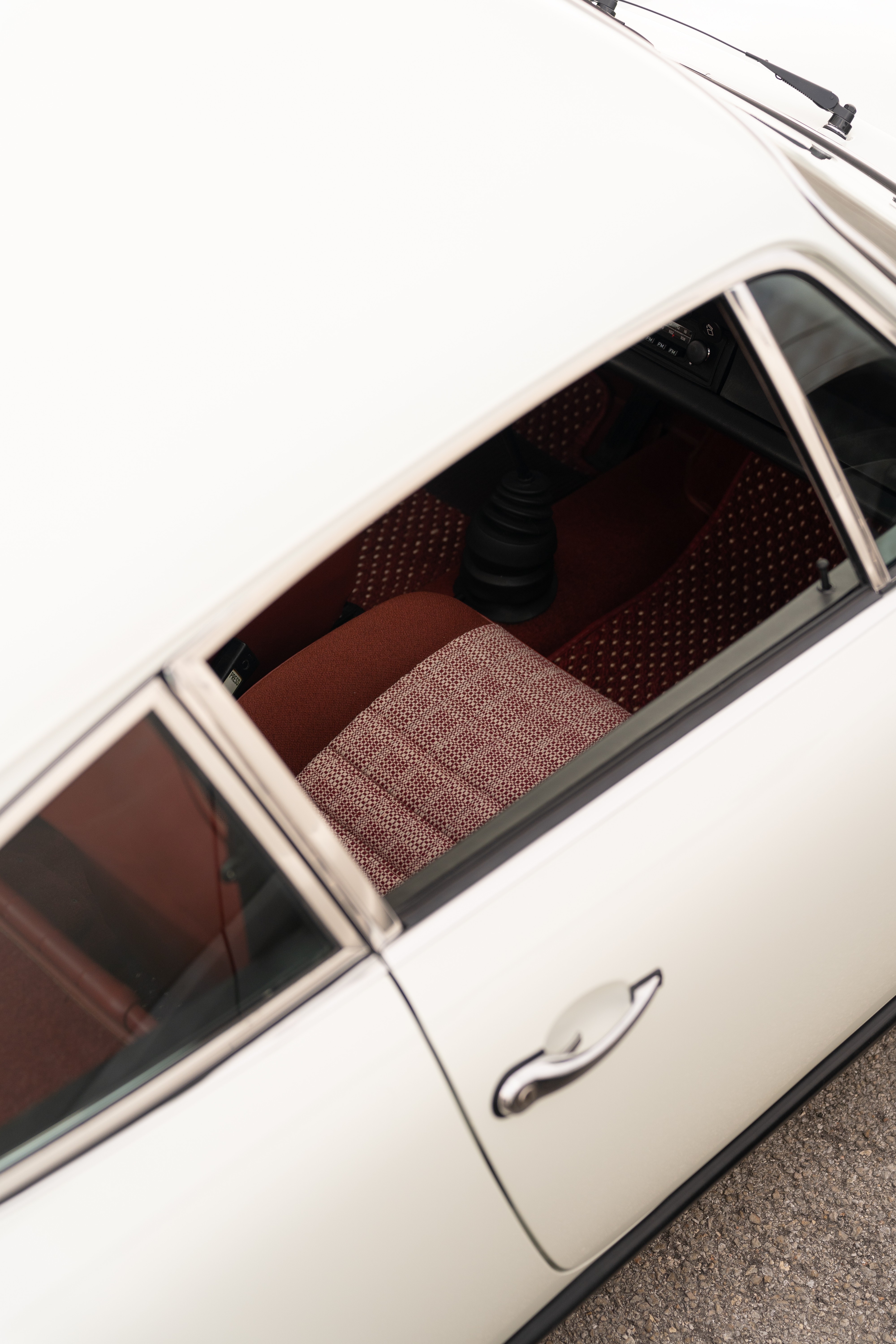 1974 Porsche 911 Coupe 5-Speed with red tweed and CoCo floor mats.