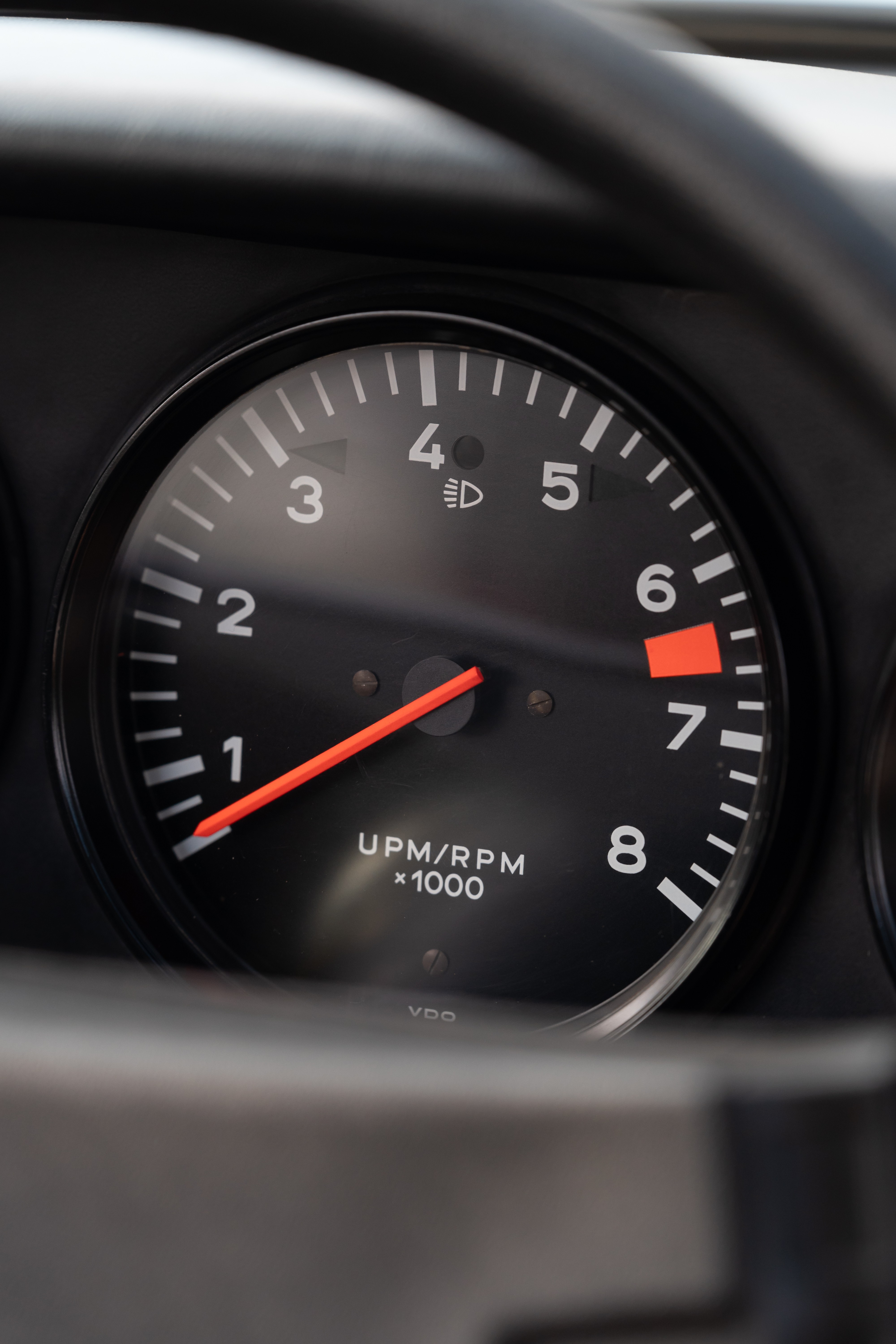 Tachometer on a White on Red 1974 Porsche 911 Coupe 5-Speed shot in Austin, TX.