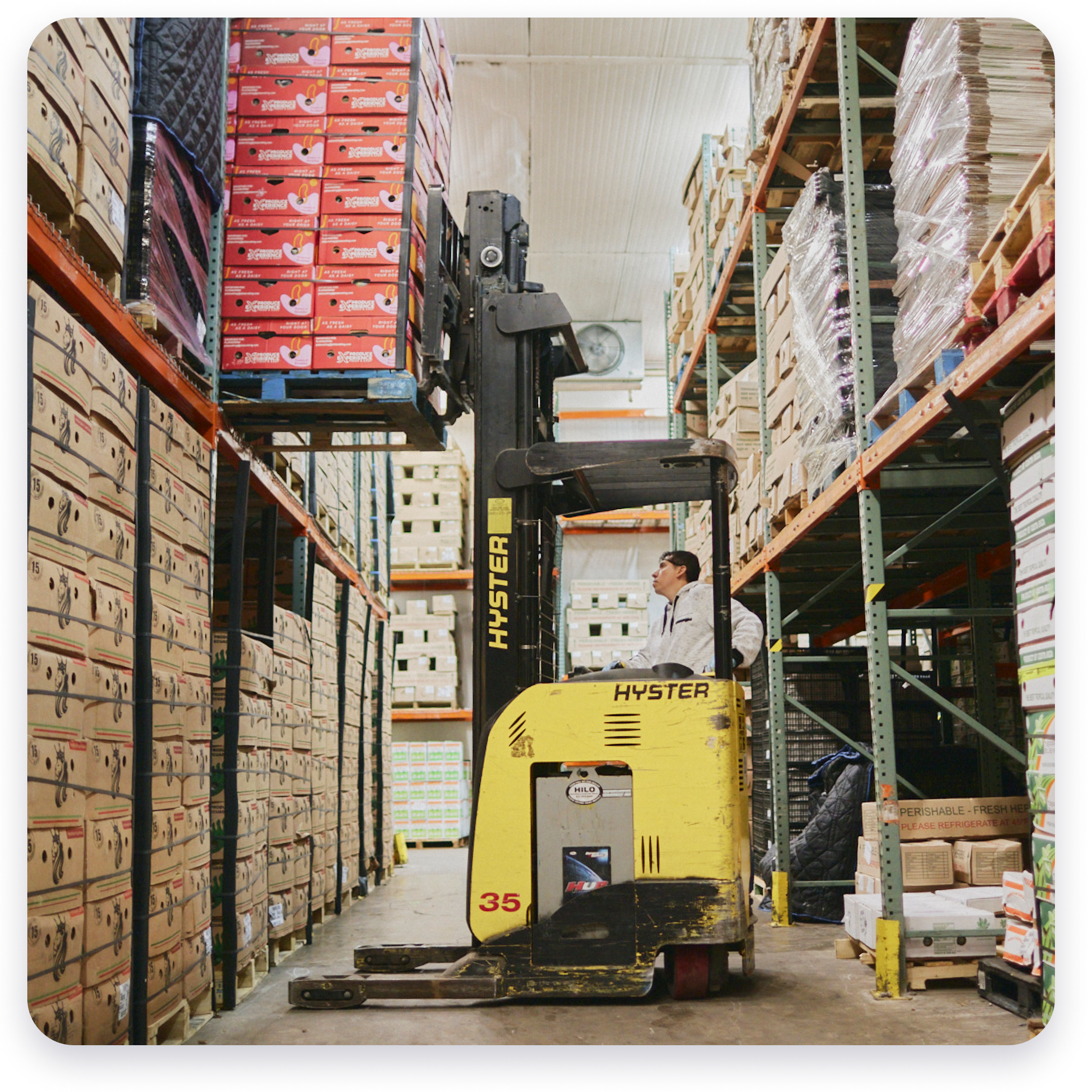 Forklift loading pallets in a warehouse