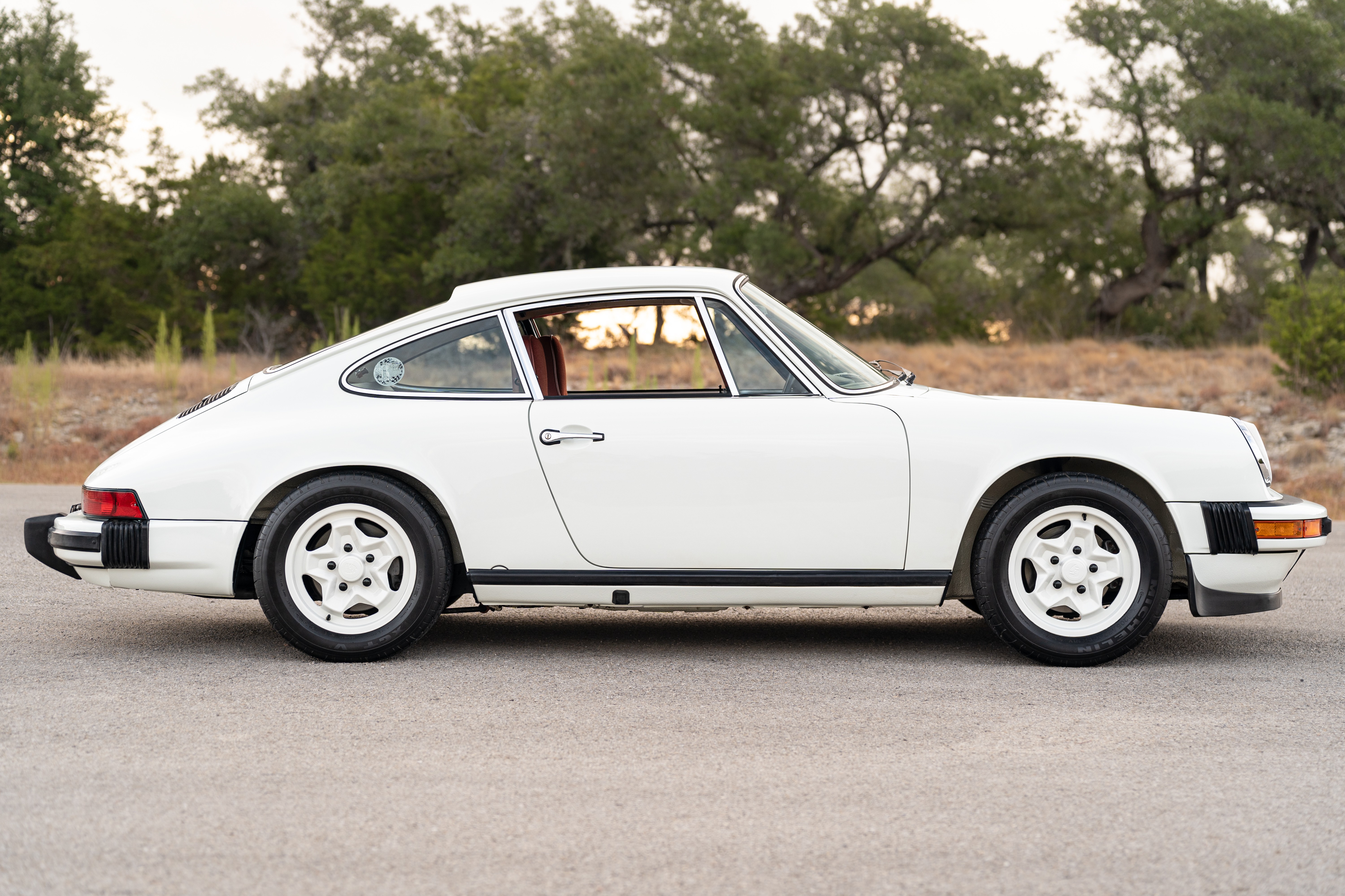 White on Red 1974 Porsche 911 Coupe 5-Speed shot in Austin, TX.