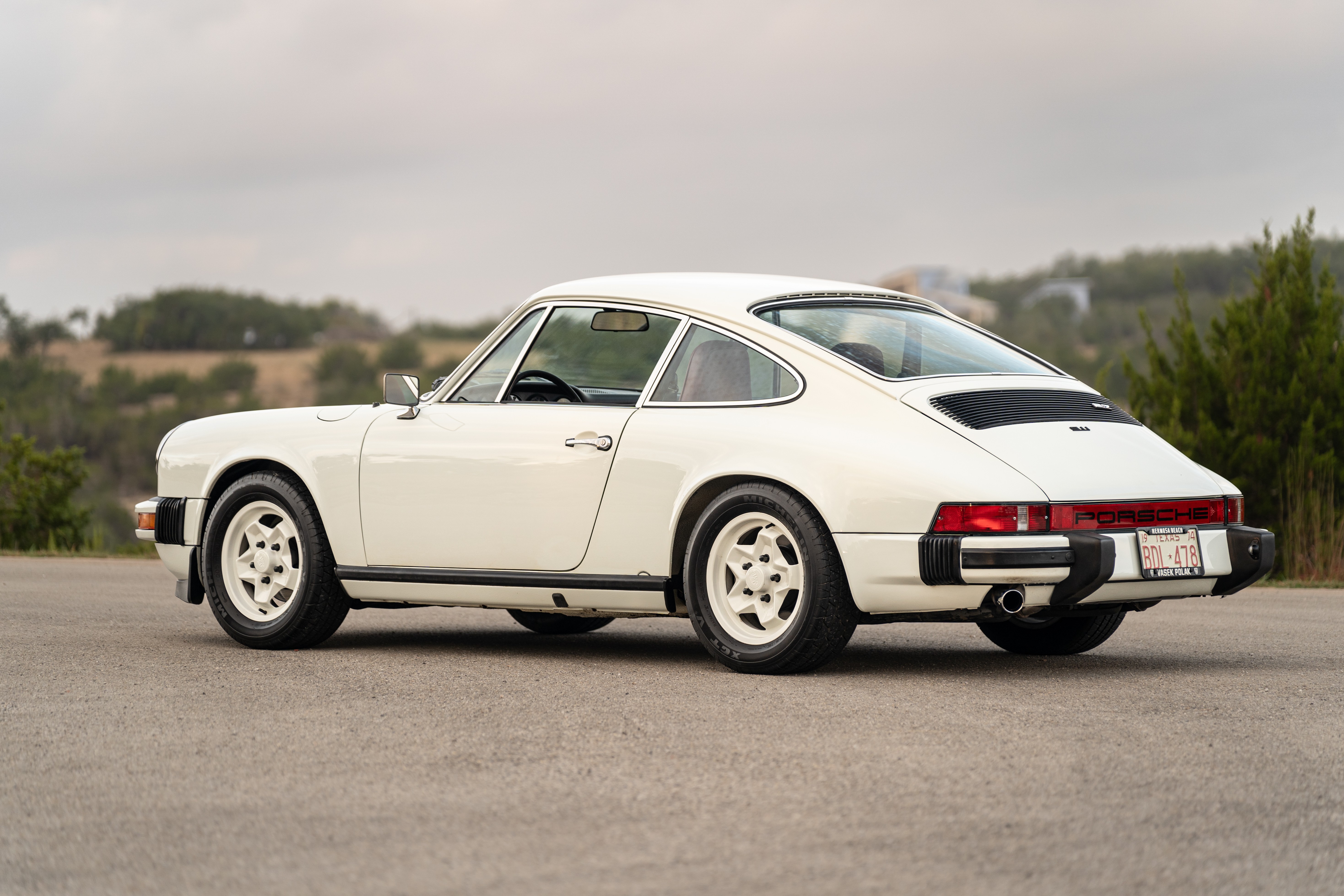 White on Red 1974 Porsche 911 Coupe 5-Speed shot in Austin, TX.