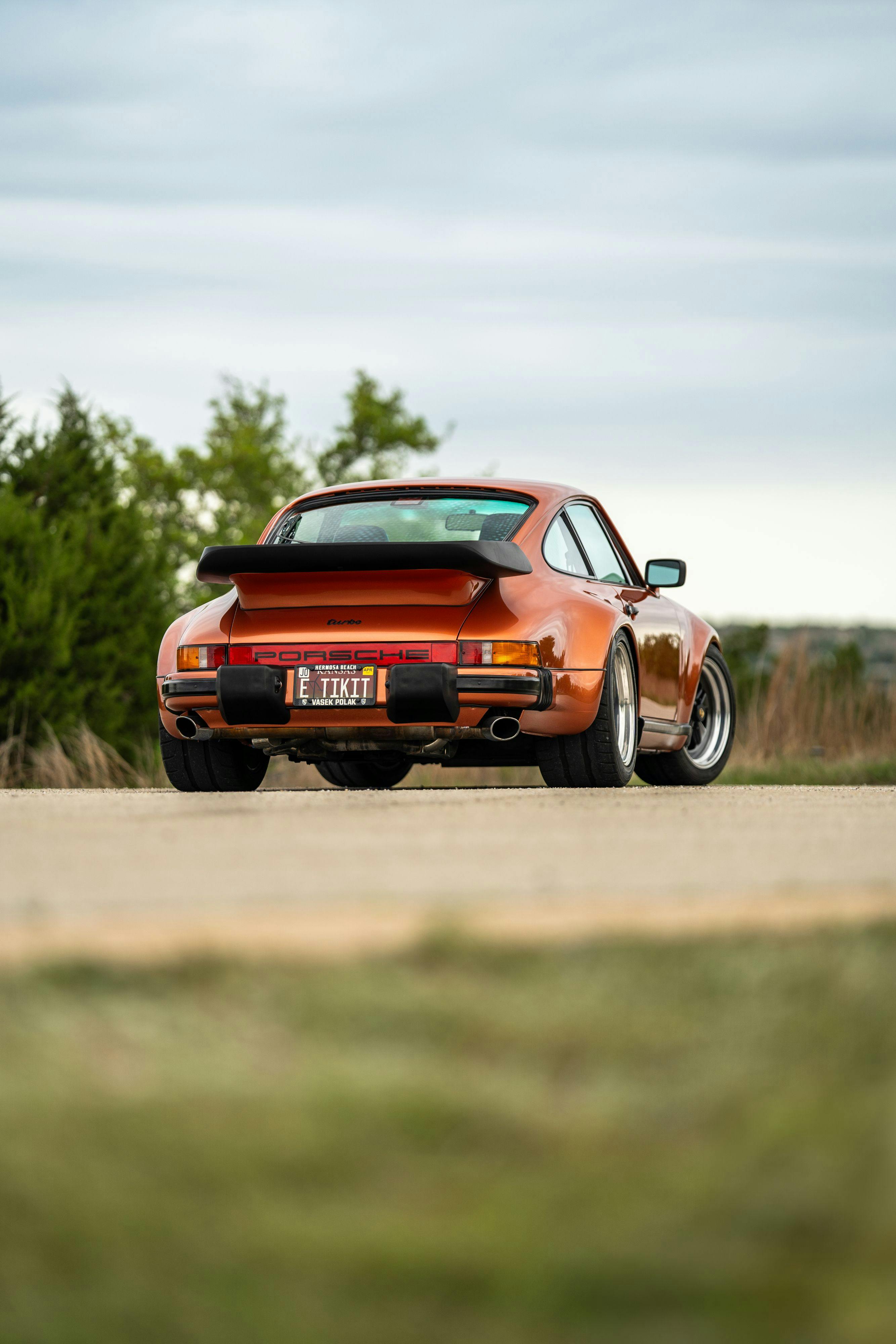 1986 Porsche 930 Turbo in Metallic Orange over Black.