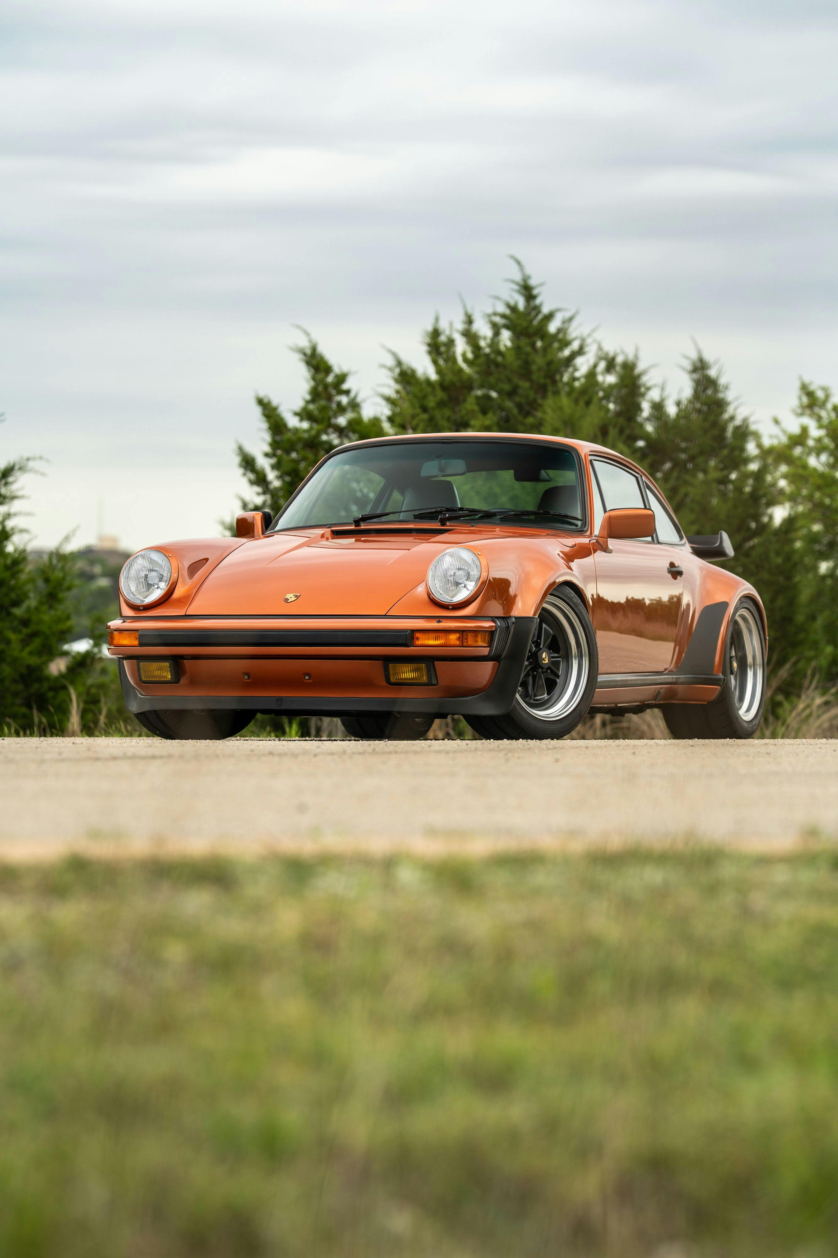 1986 Porsche 930 Turbo in Metallic Orange over Black.