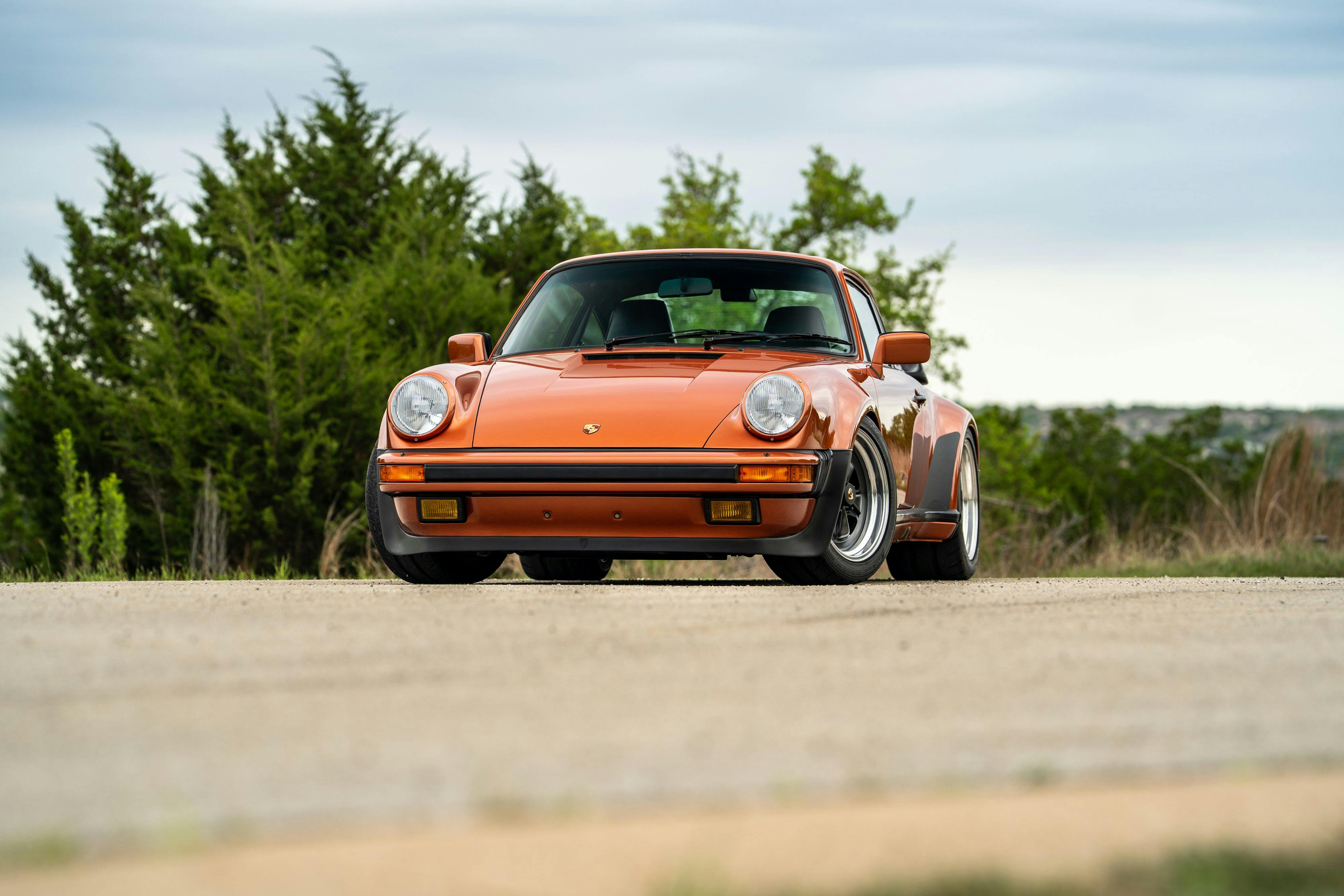 1986 Porsche 930 Turbo in Metallic Orange over Black.