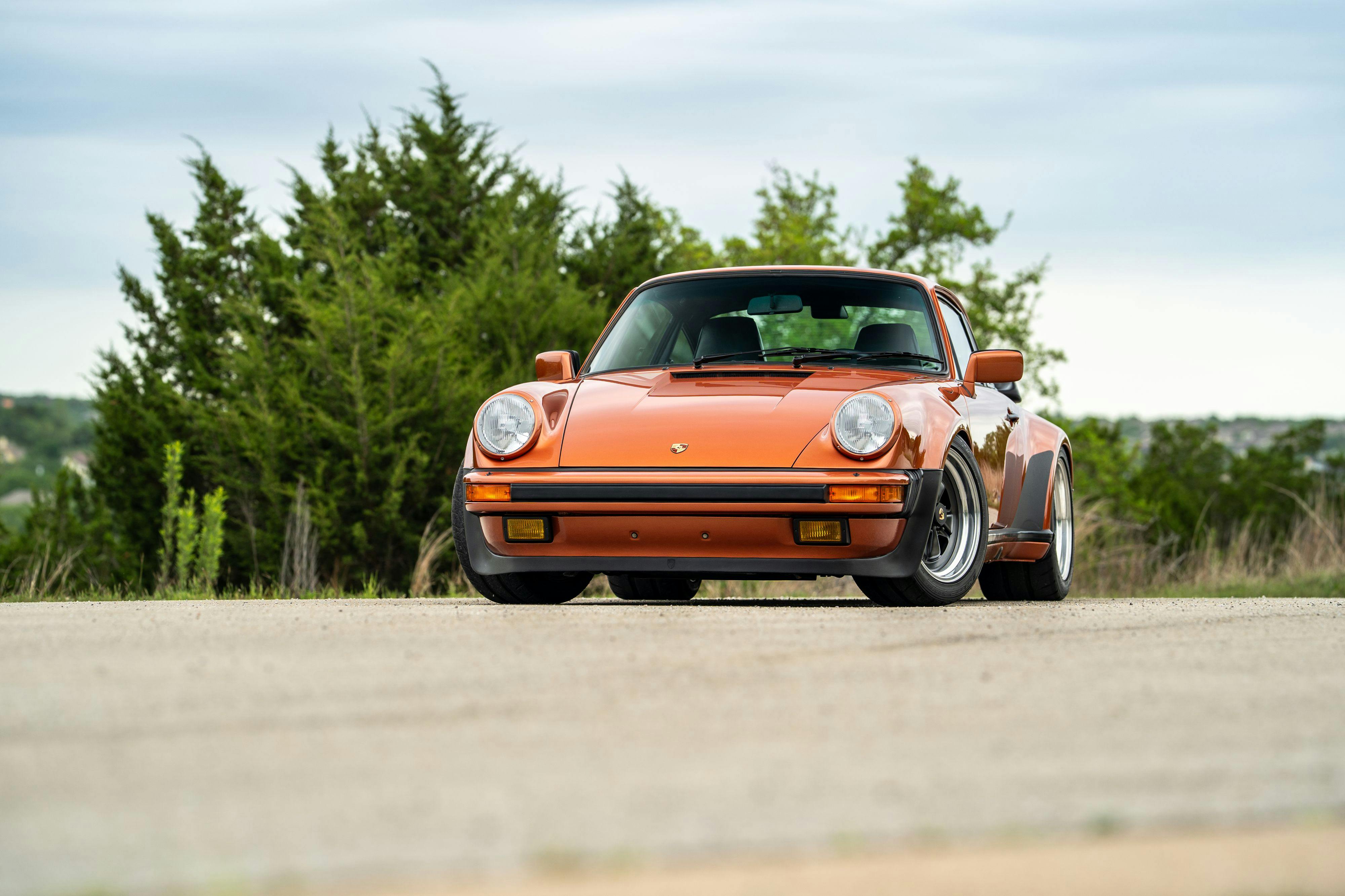 1986 Porsche 930 Turbo in Metallic Orange over Black.