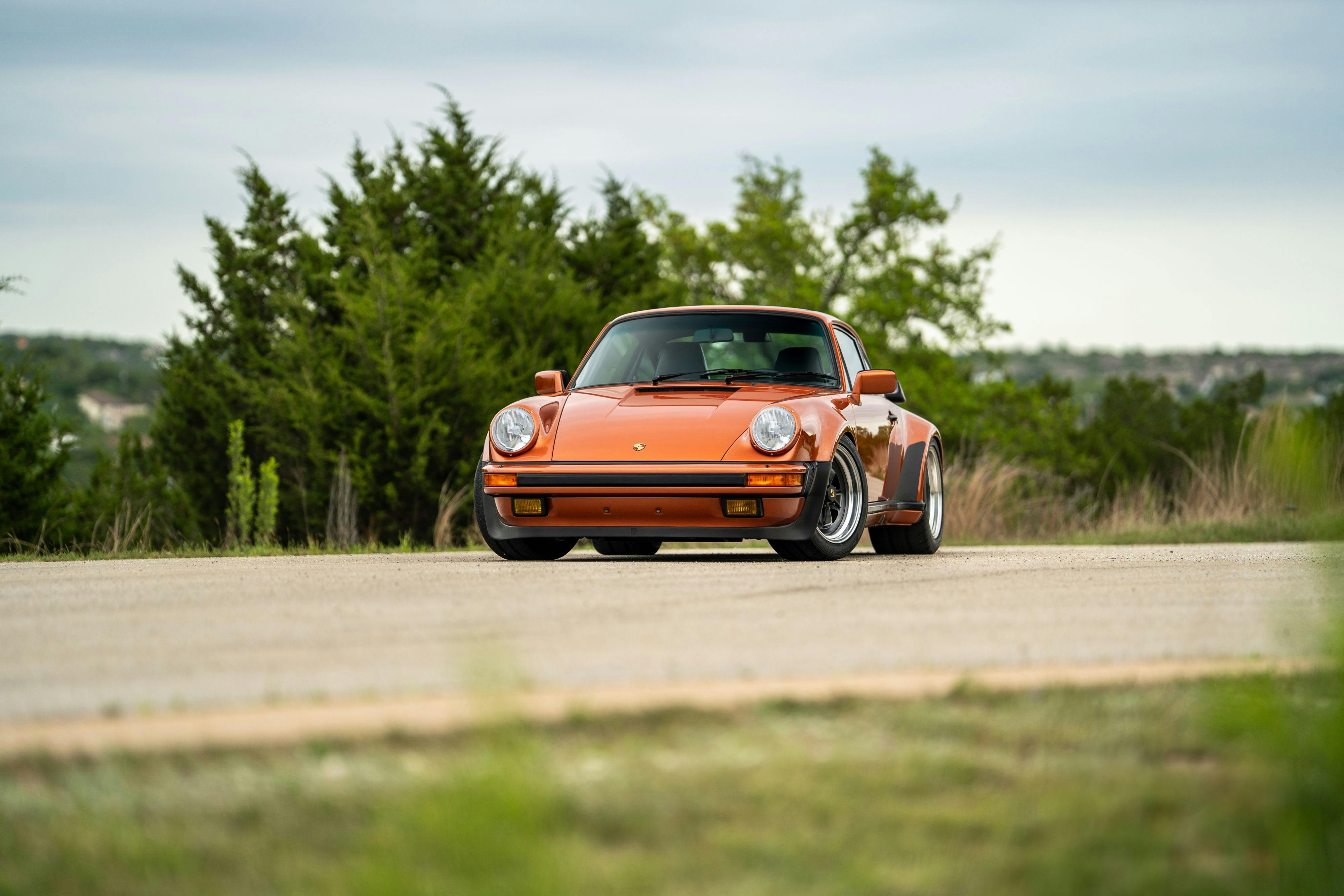 1986 Porsche 930 Turbo in Metallic Orange over Black.