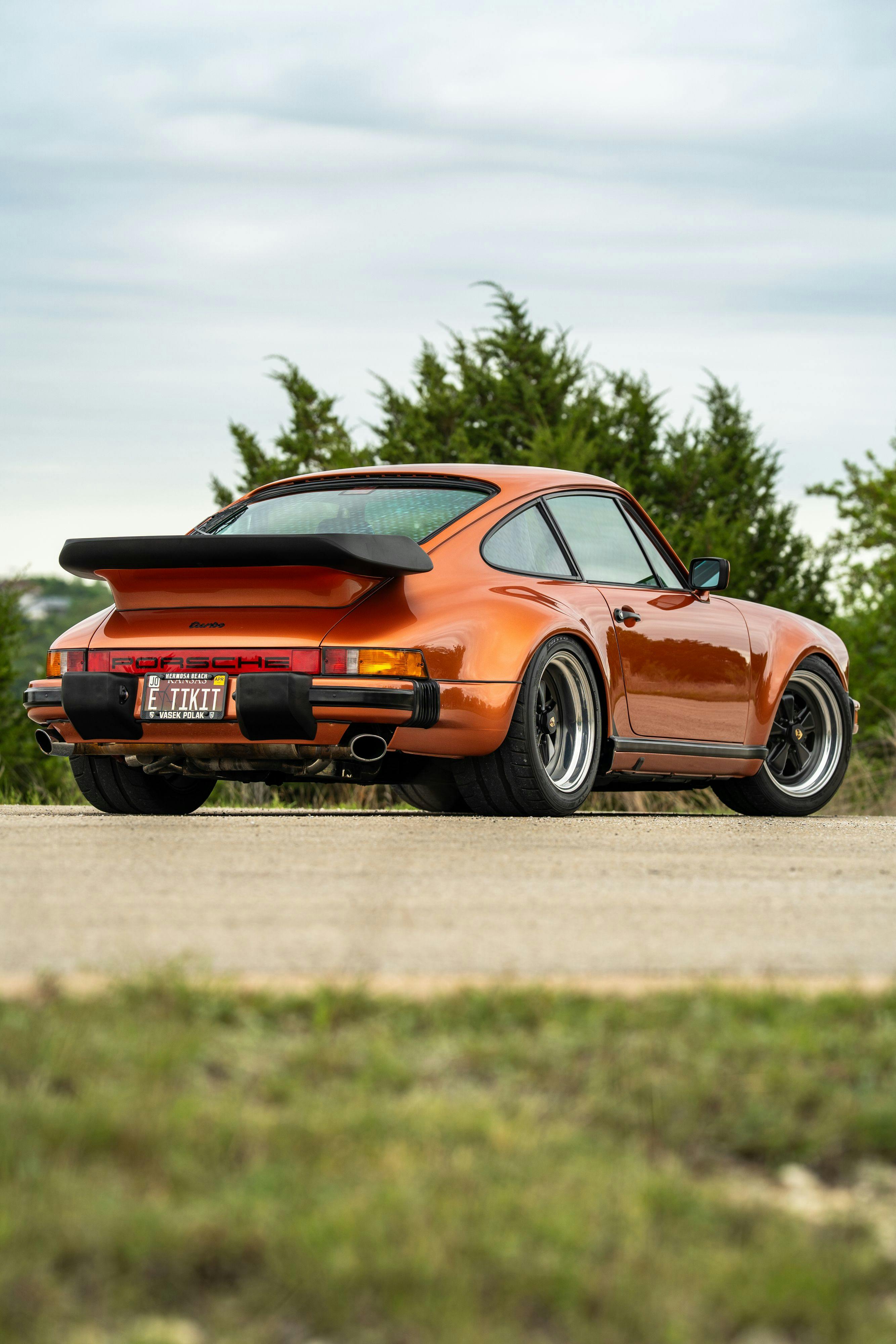 1986 Porsche 930 Turbo in Metallic Orange over Black.
