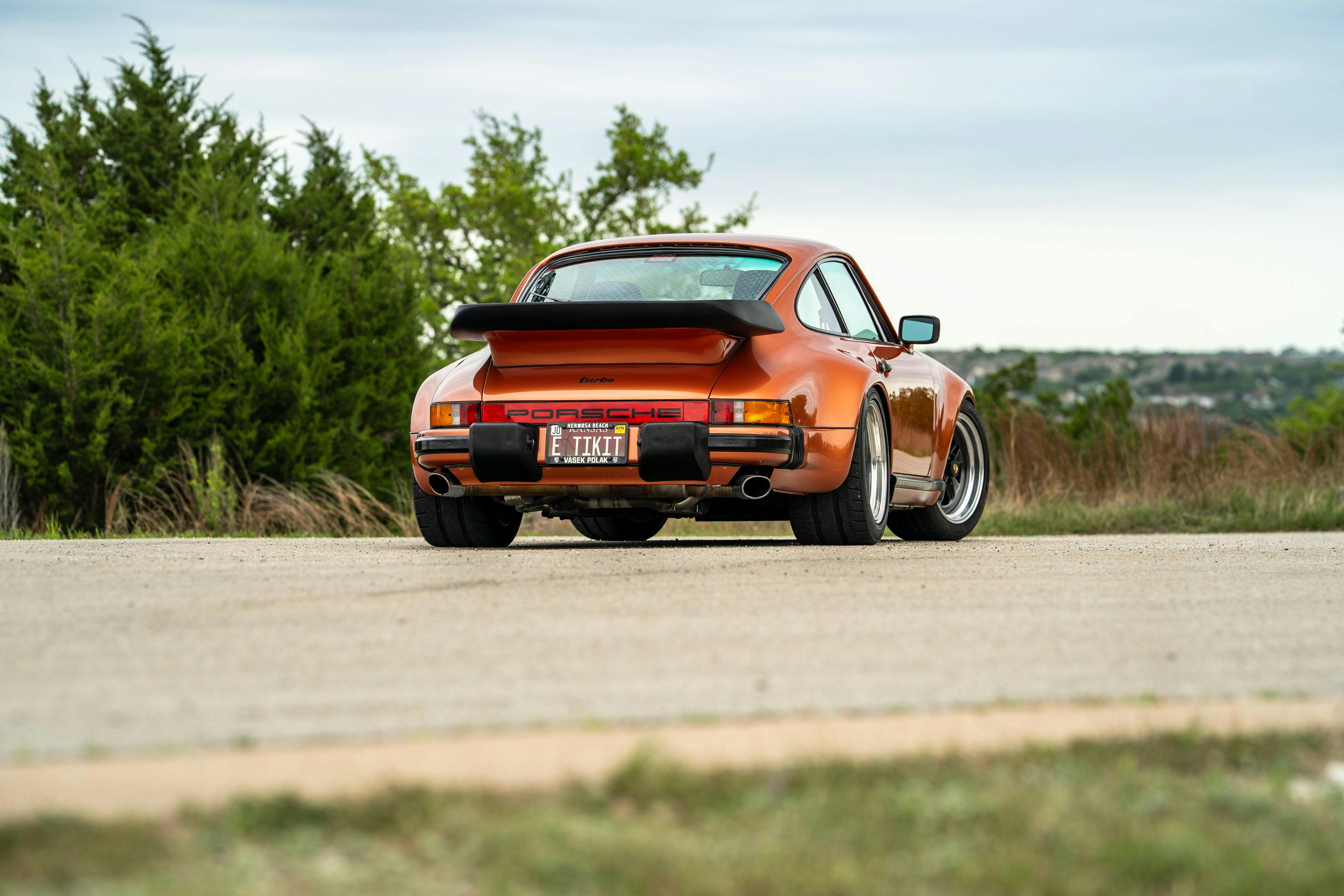 1986 Porsche 930 Turbo in Metallic Orange over Black.