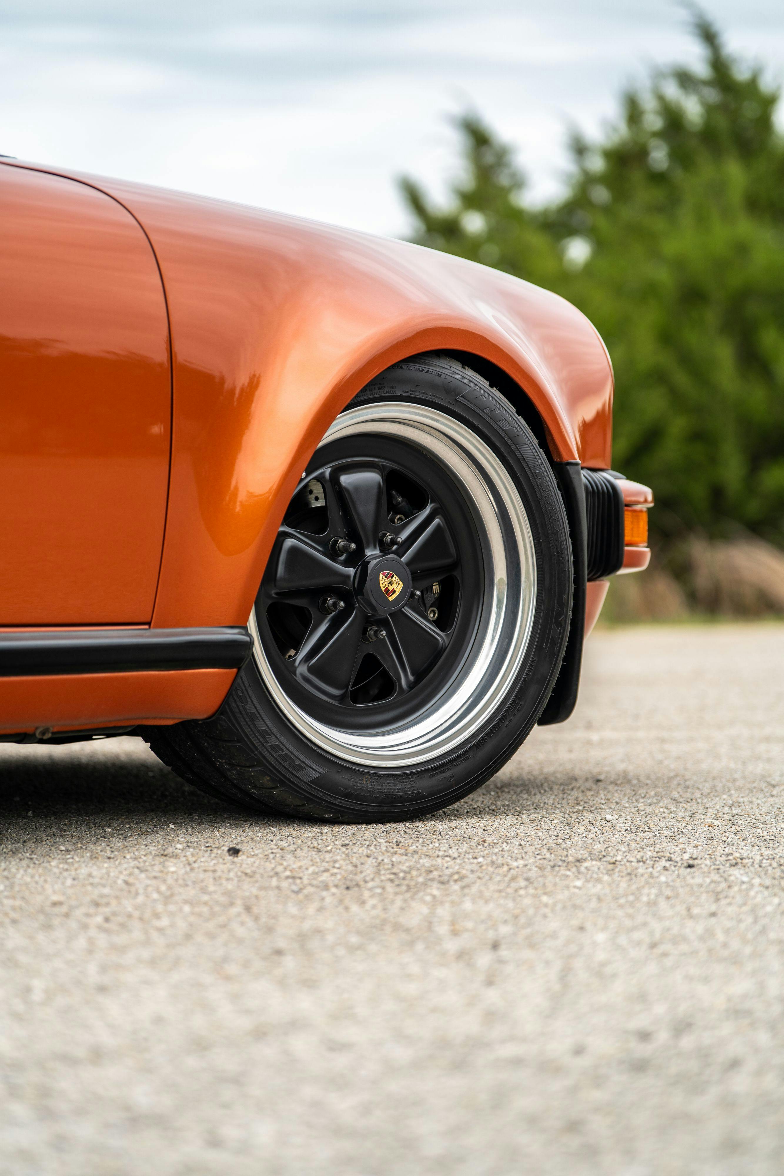 1986 Porsche 930 Turbo in Metallic Orange over Black.