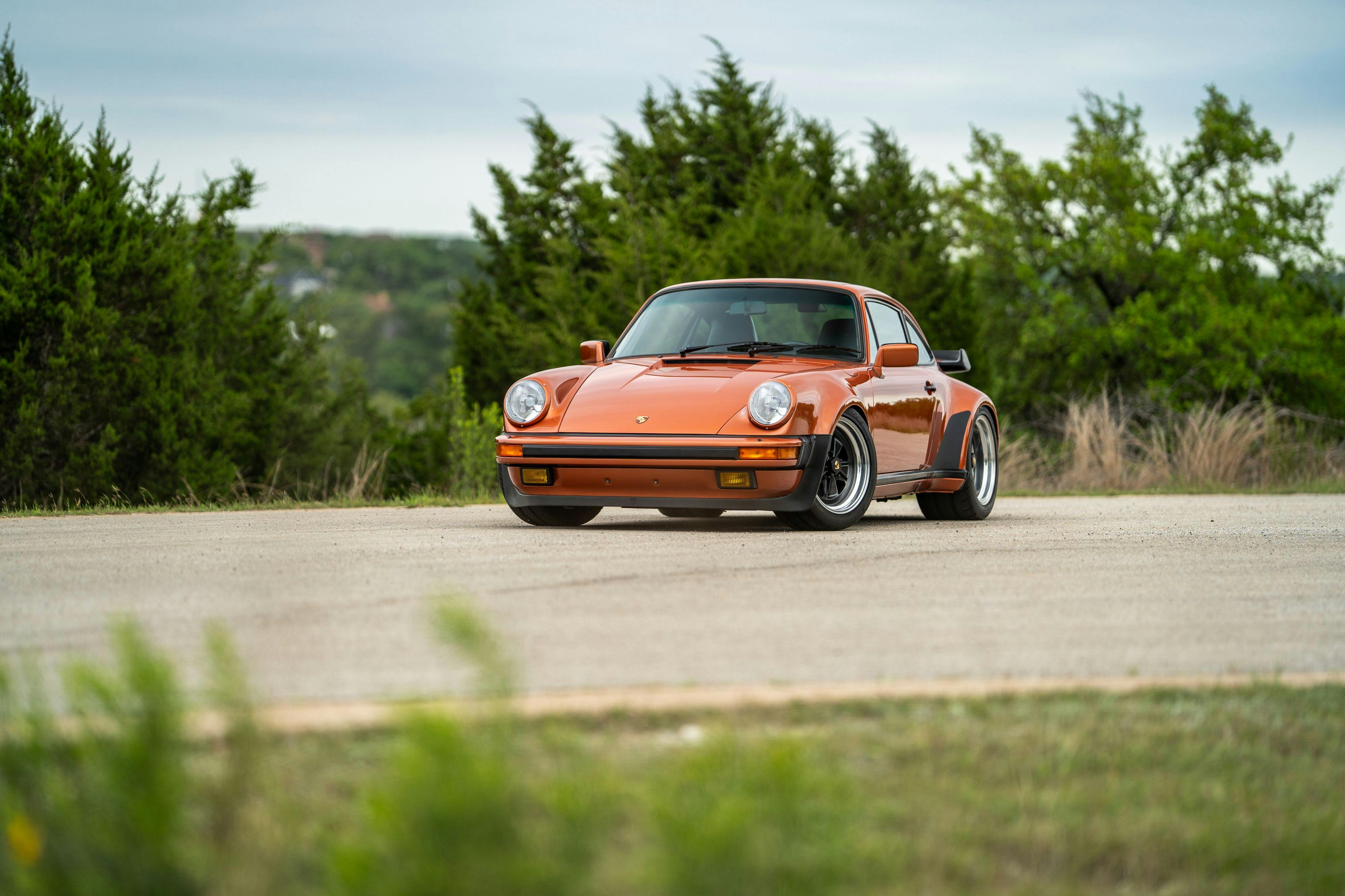 1986 Porsche 930 Turbo in Metallic Orange over Black.