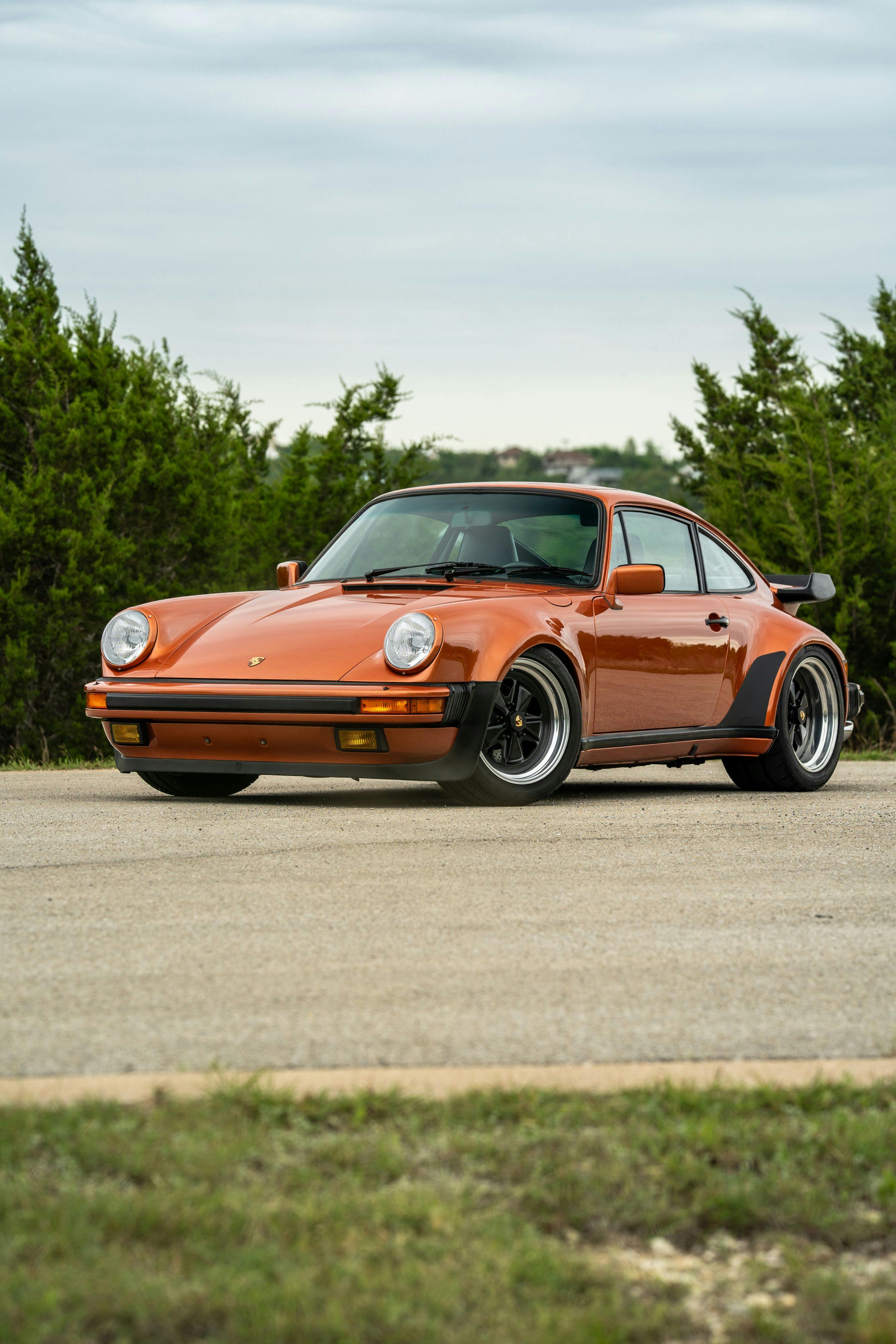 1986 Porsche 930 Turbo in Metallic Orange over Black.