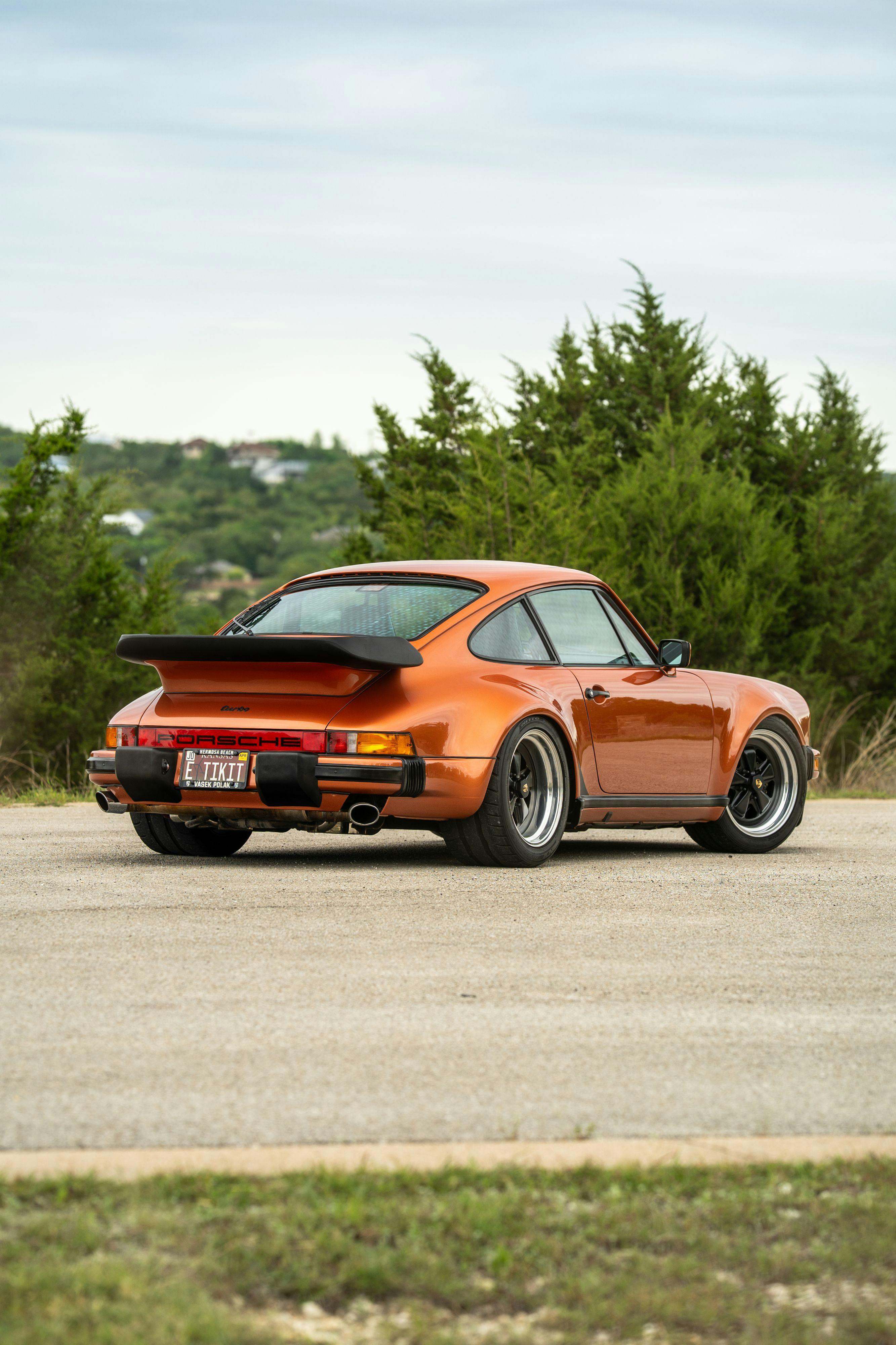 1986 Porsche 930 Turbo in Metallic Orange over Black.