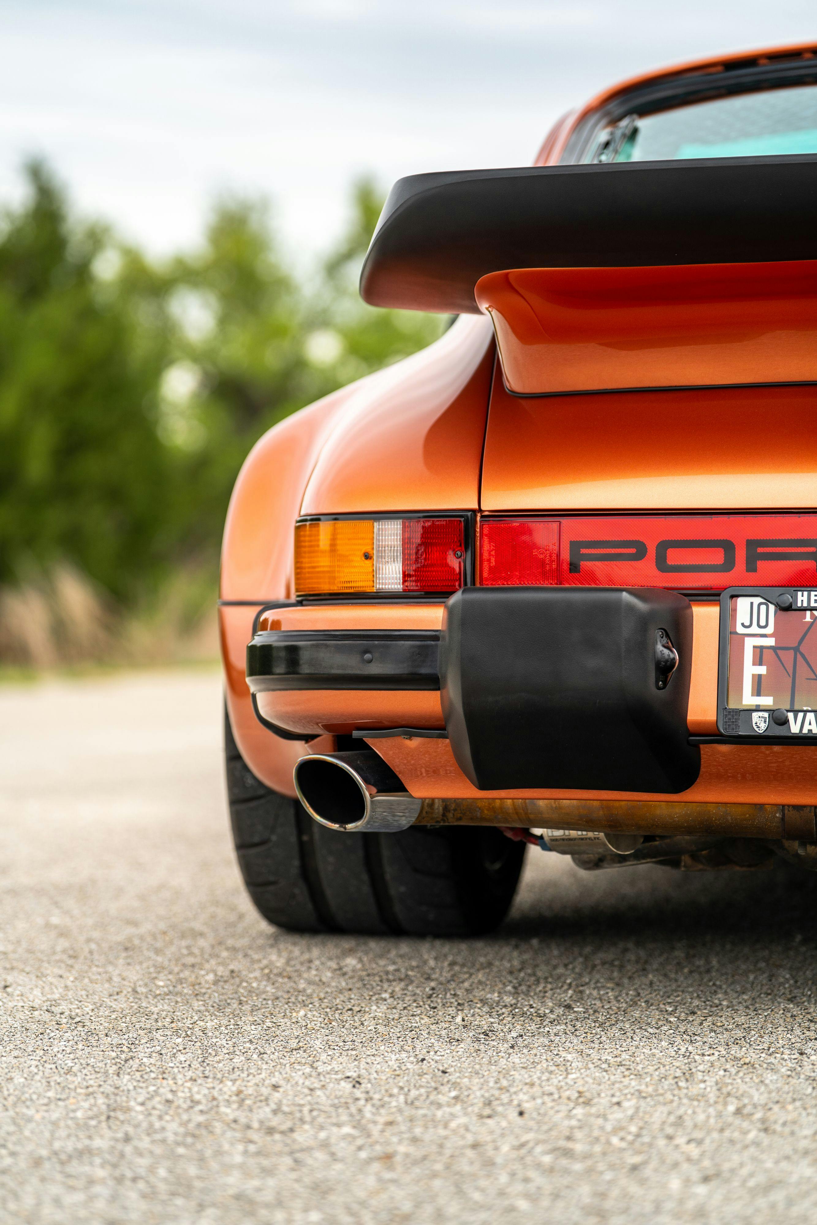 1986 Porsche 930 Turbo in Metallic Orange over Black.