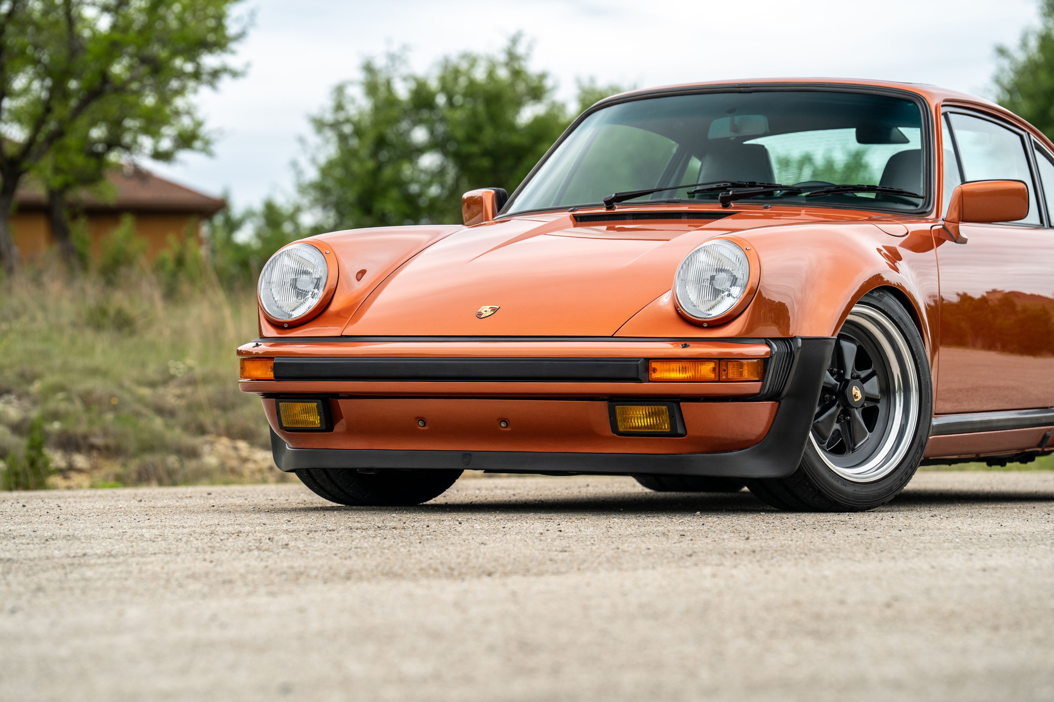 1986 Porsche 930 Turbo in Metallic Orange over Black.