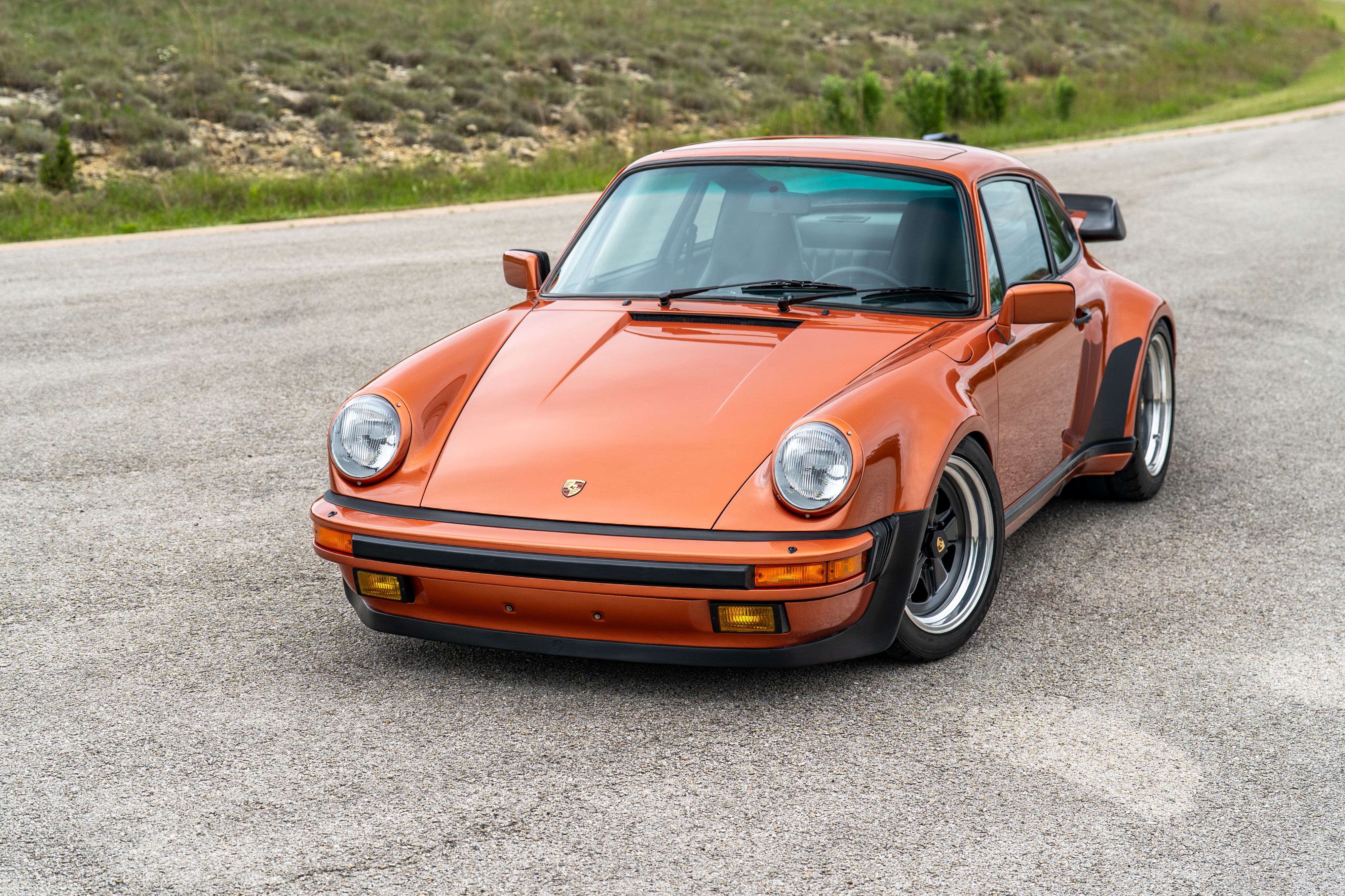 1986 Porsche 930 Turbo in Metallic Orange over Black.