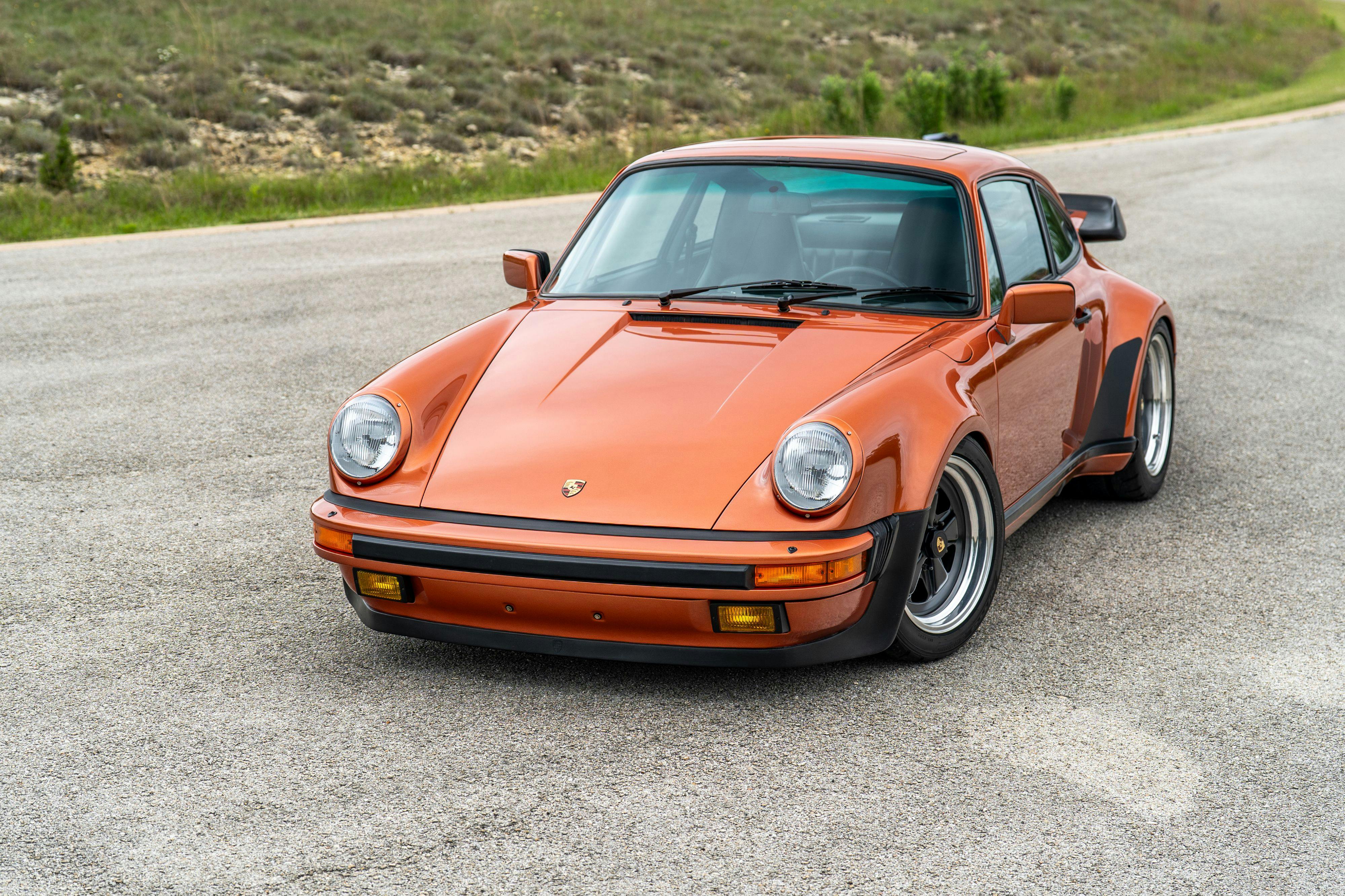 1986 Porsche 930 Turbo in Metallic Orange over Black.