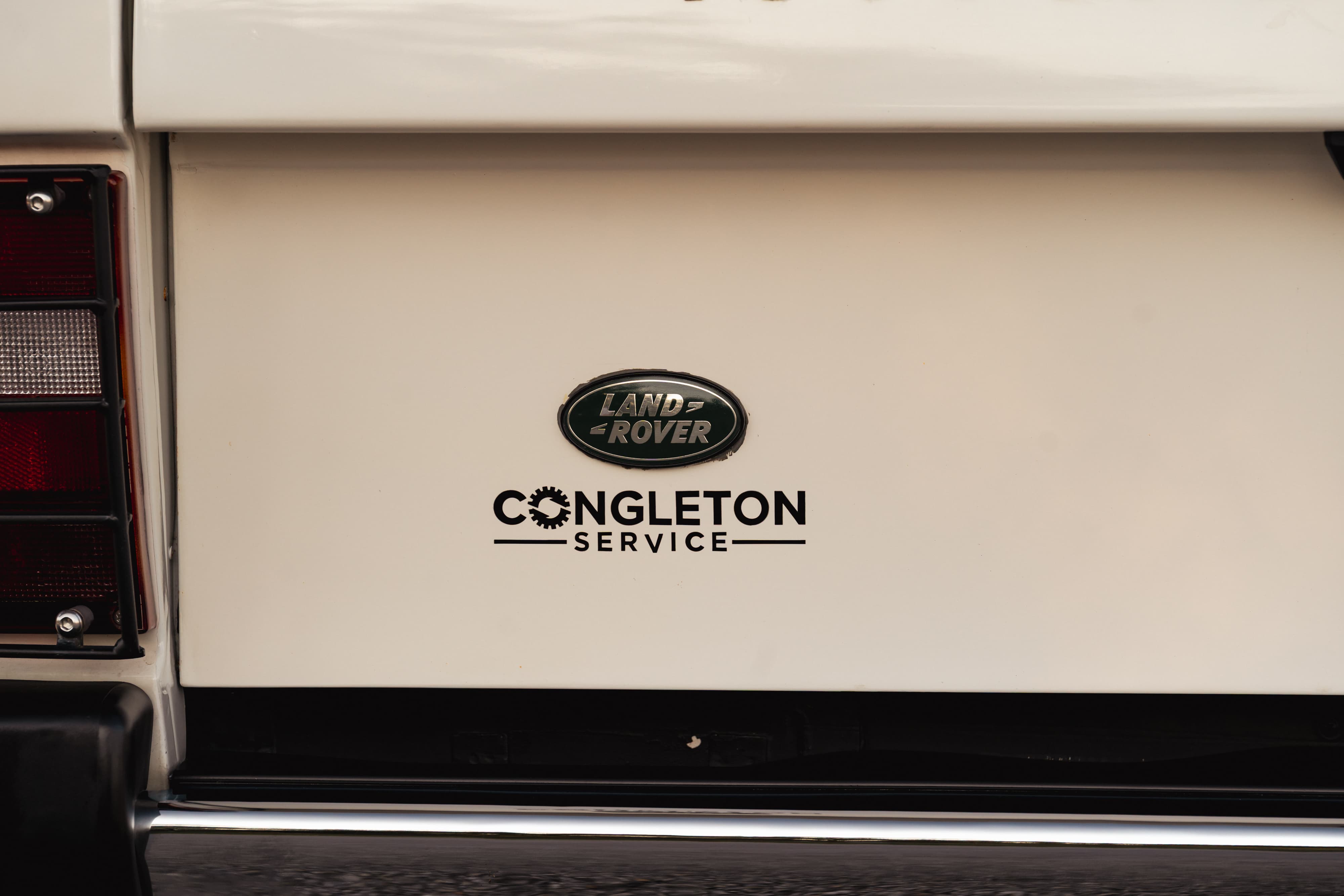 Badging on a 1995 White Land Rover Range Rover County Long Wheel Base in Austin, TX.