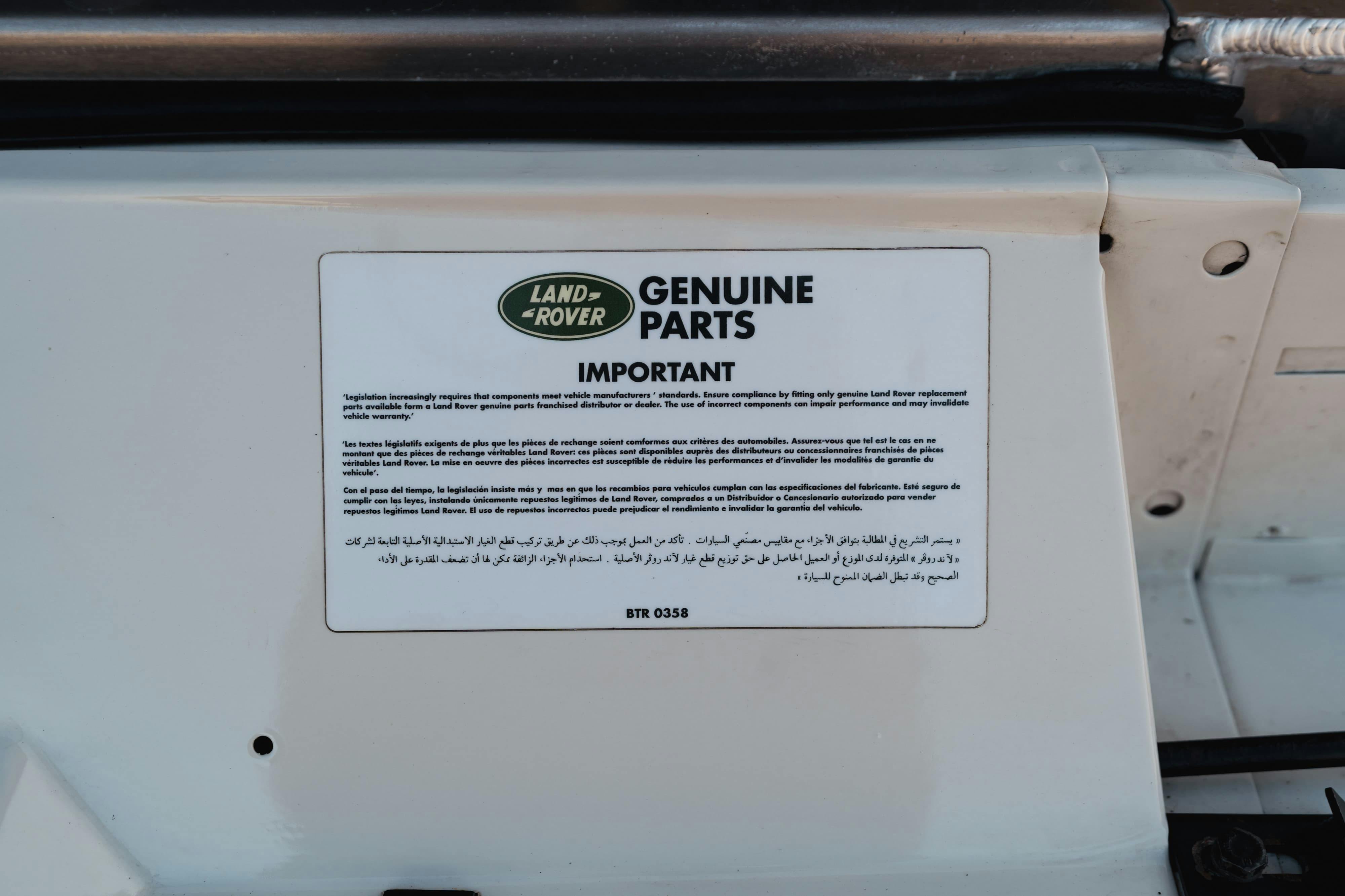 Engine bay stickers on a 1995 White Land Rover Range Rover County Long Wheel Base in Austin, TX.