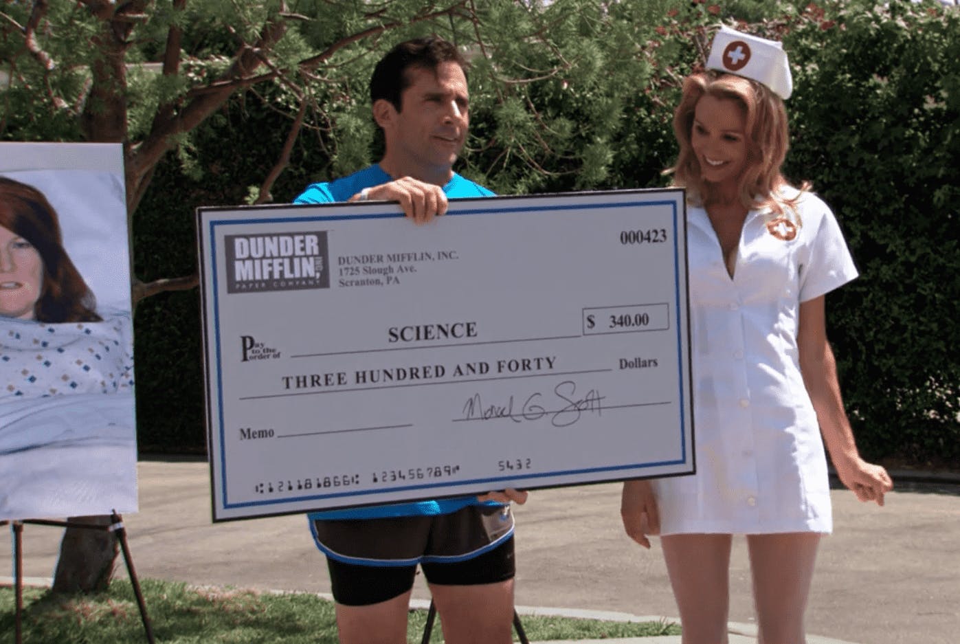 Michael Scott from The Office giving cheque to a stripper