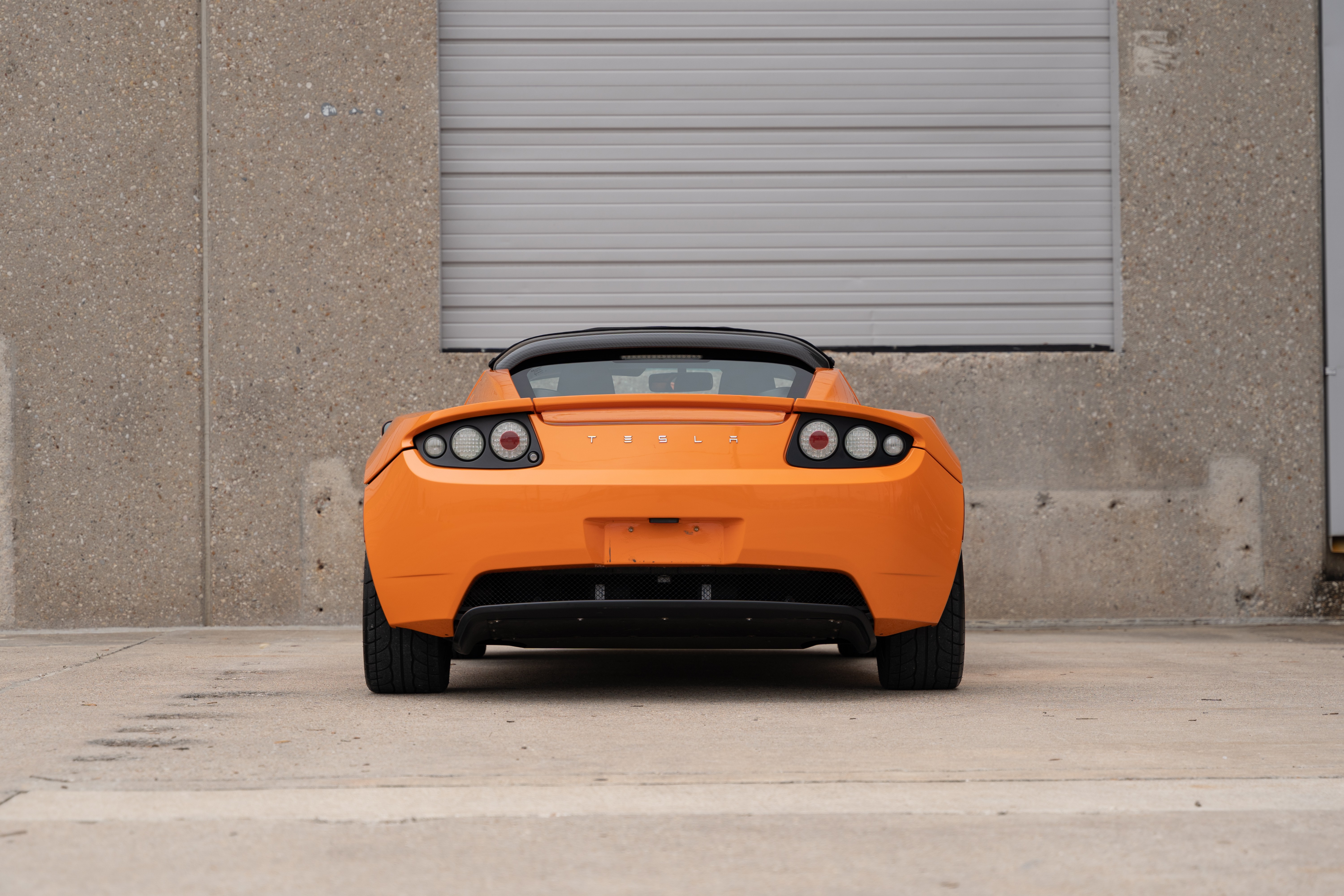 2010 Very Orange Metallic Tesla Roadster in Austin, TX.