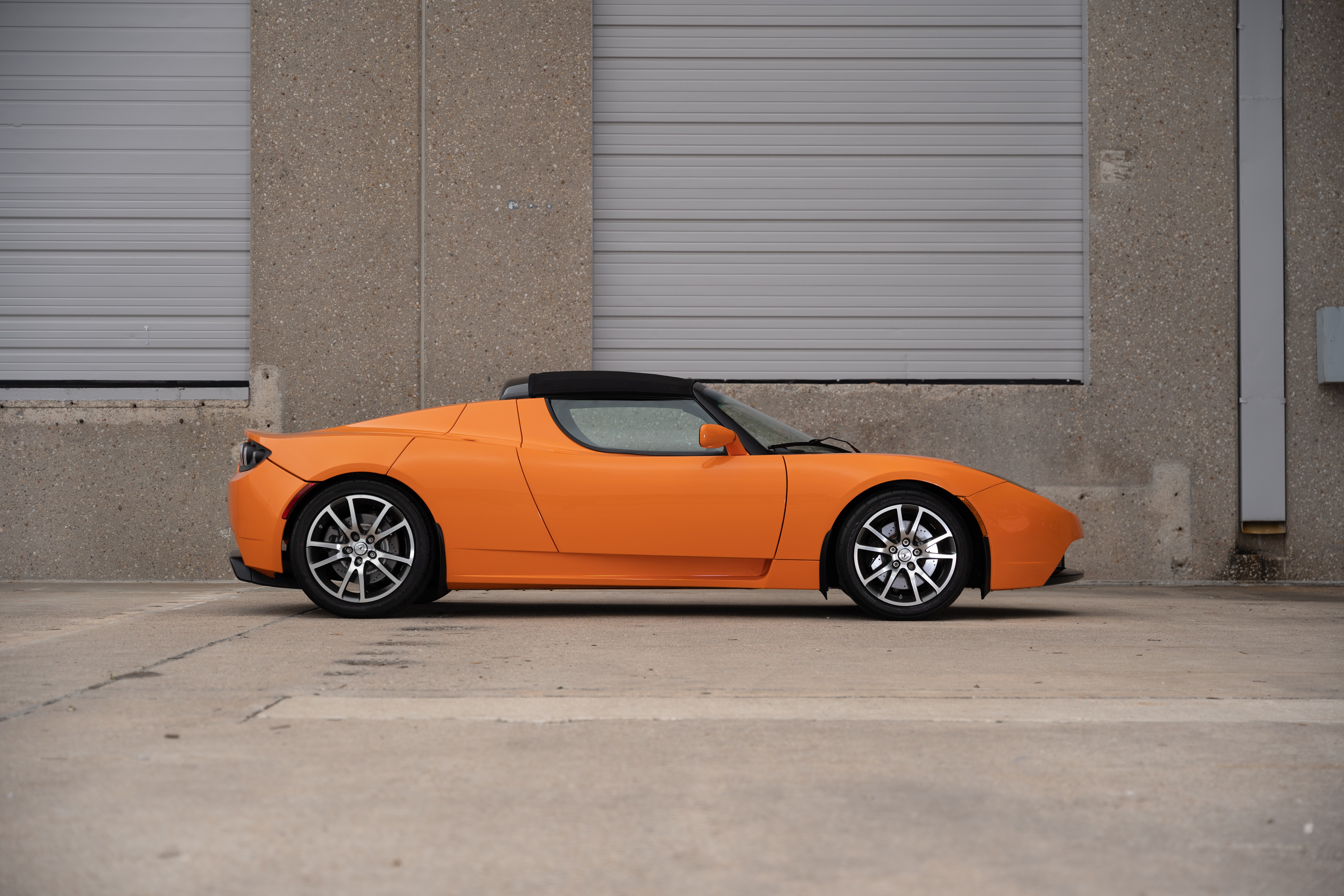 2010 Very Orange Metallic Tesla Roadster in Austin, TX.